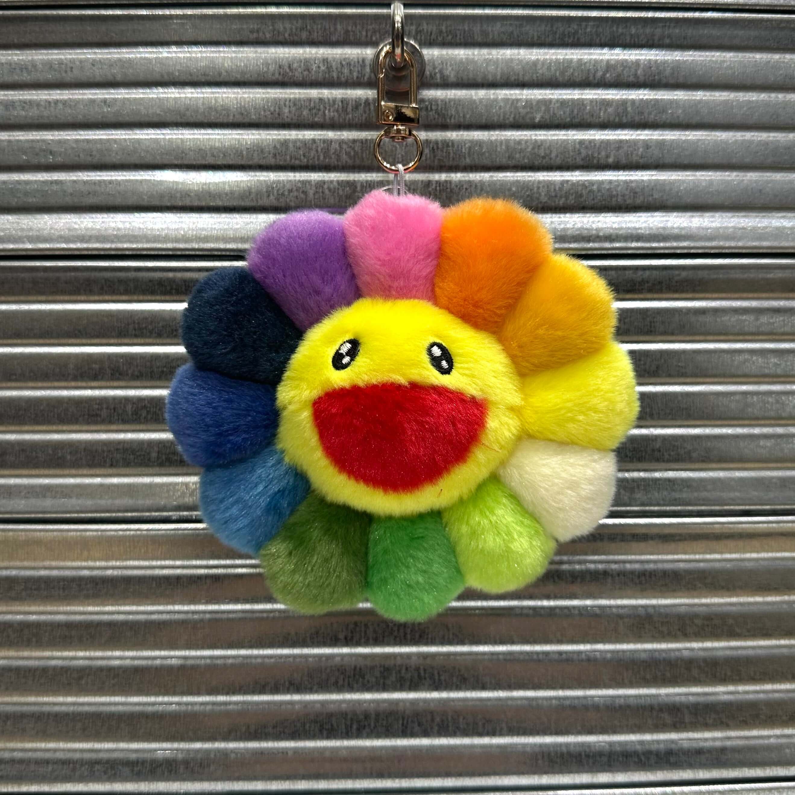 Takashi Murakami Mascot Plush Keychain 12cm featuring a colorful flower with a smiling face.