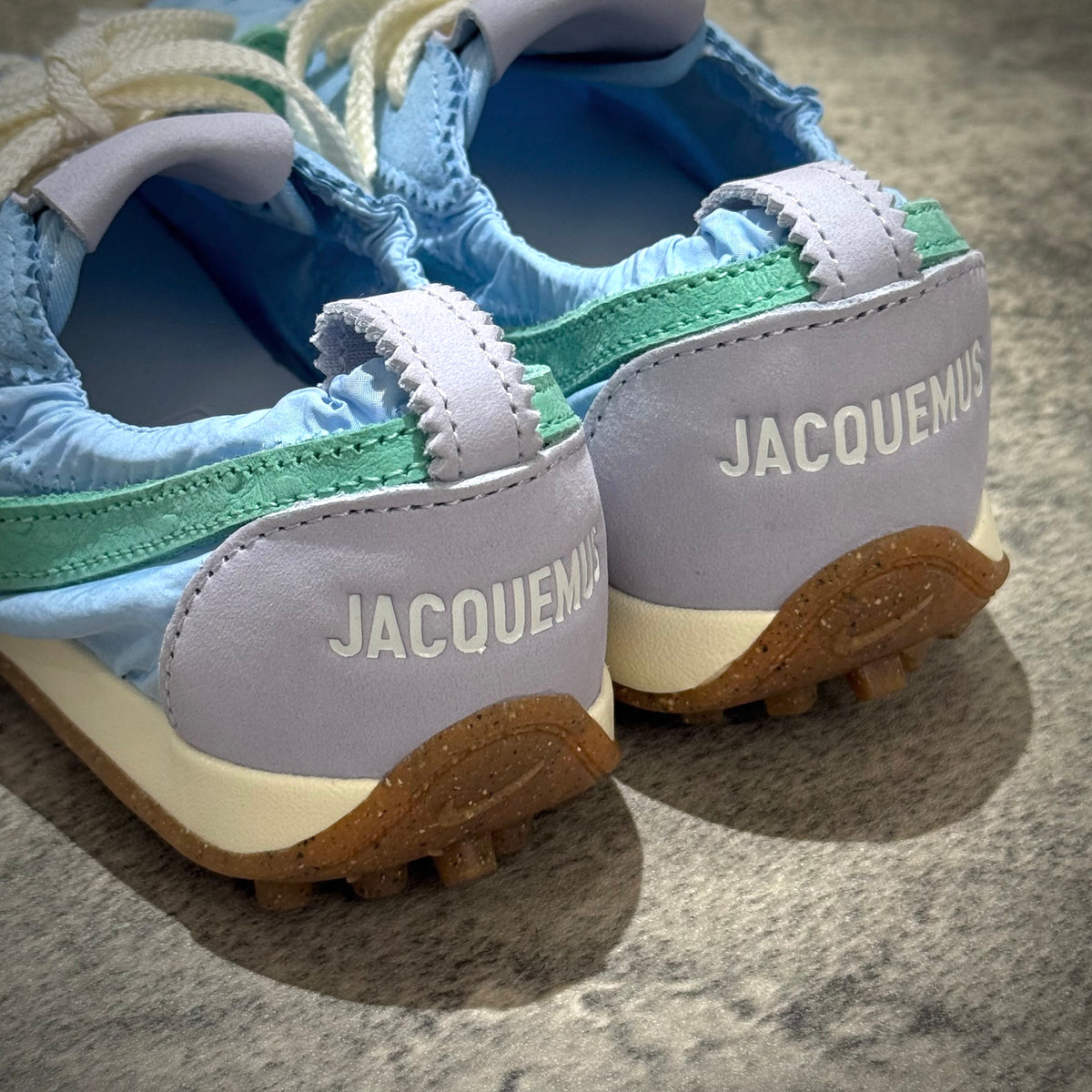 Jacquemus x Nike Moon Shoe SP - Emerald Rise HV8547-300 rear view showcasing blue and green design with prominent Jacquemus branding.
