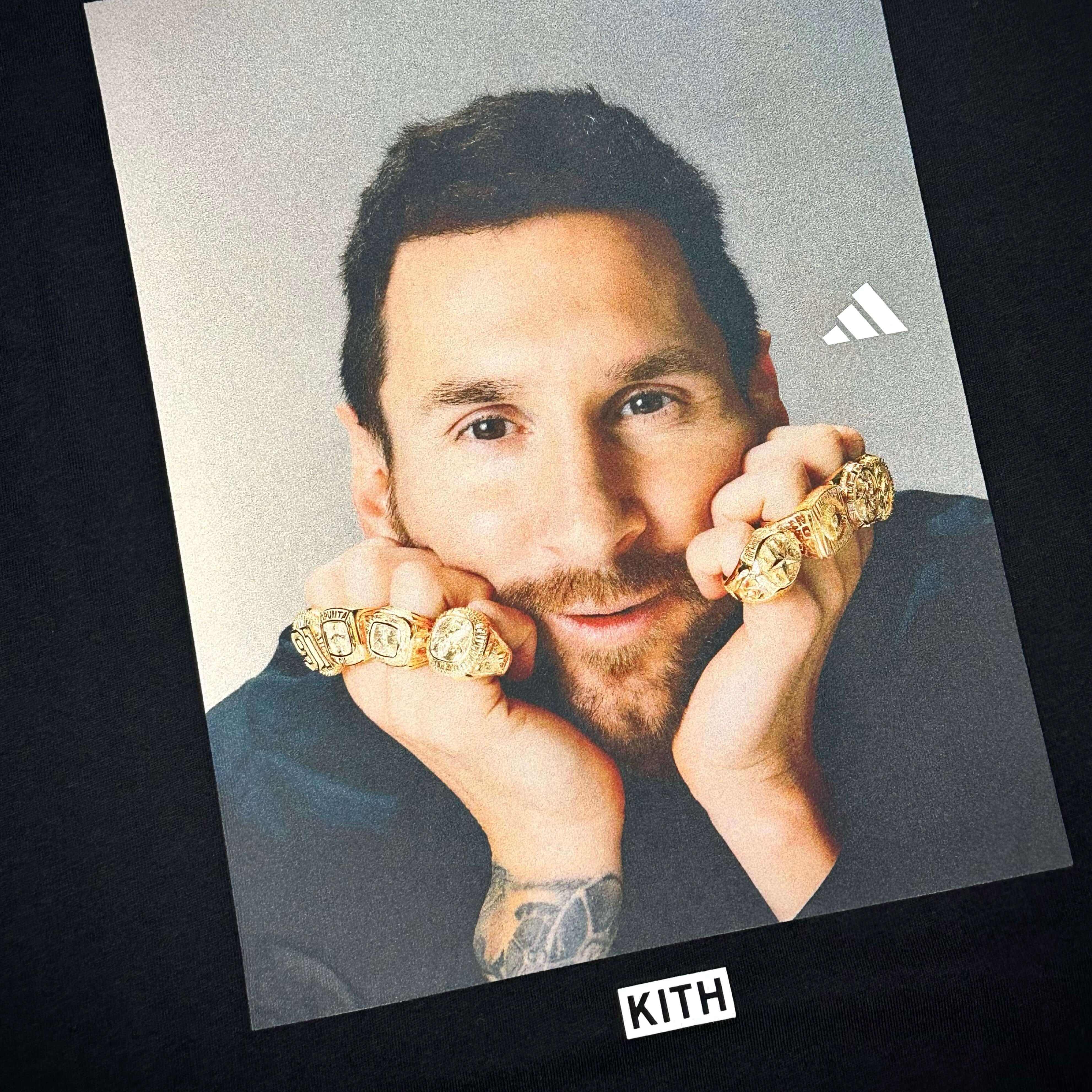 KITH x MESSI for adidas Football Ring Photo Tee featuring Messi with championship rings on his fingers.