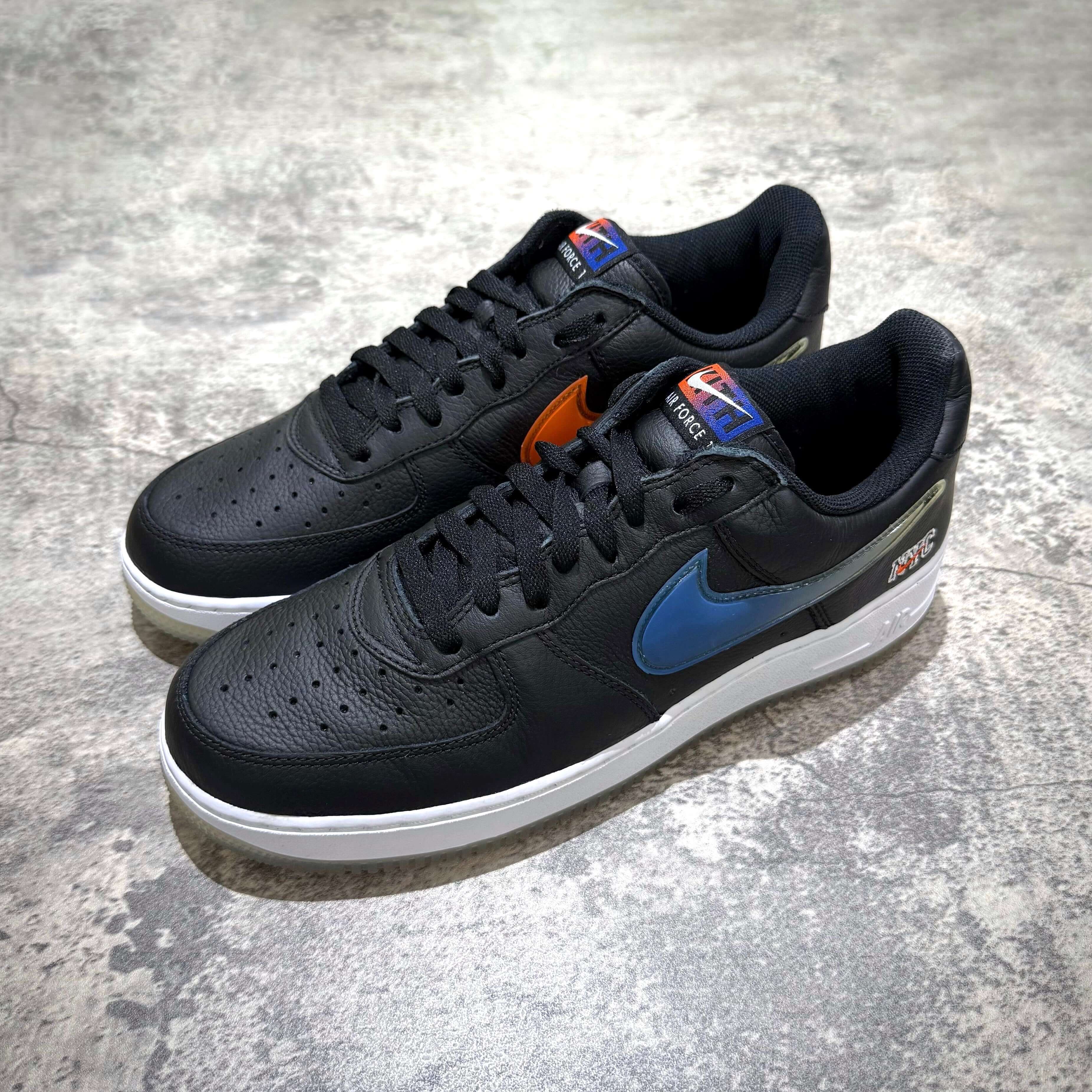 KITH x Nike Air Force 1 Low Knicks in black with orange and blue accents, stylish sneaker model.