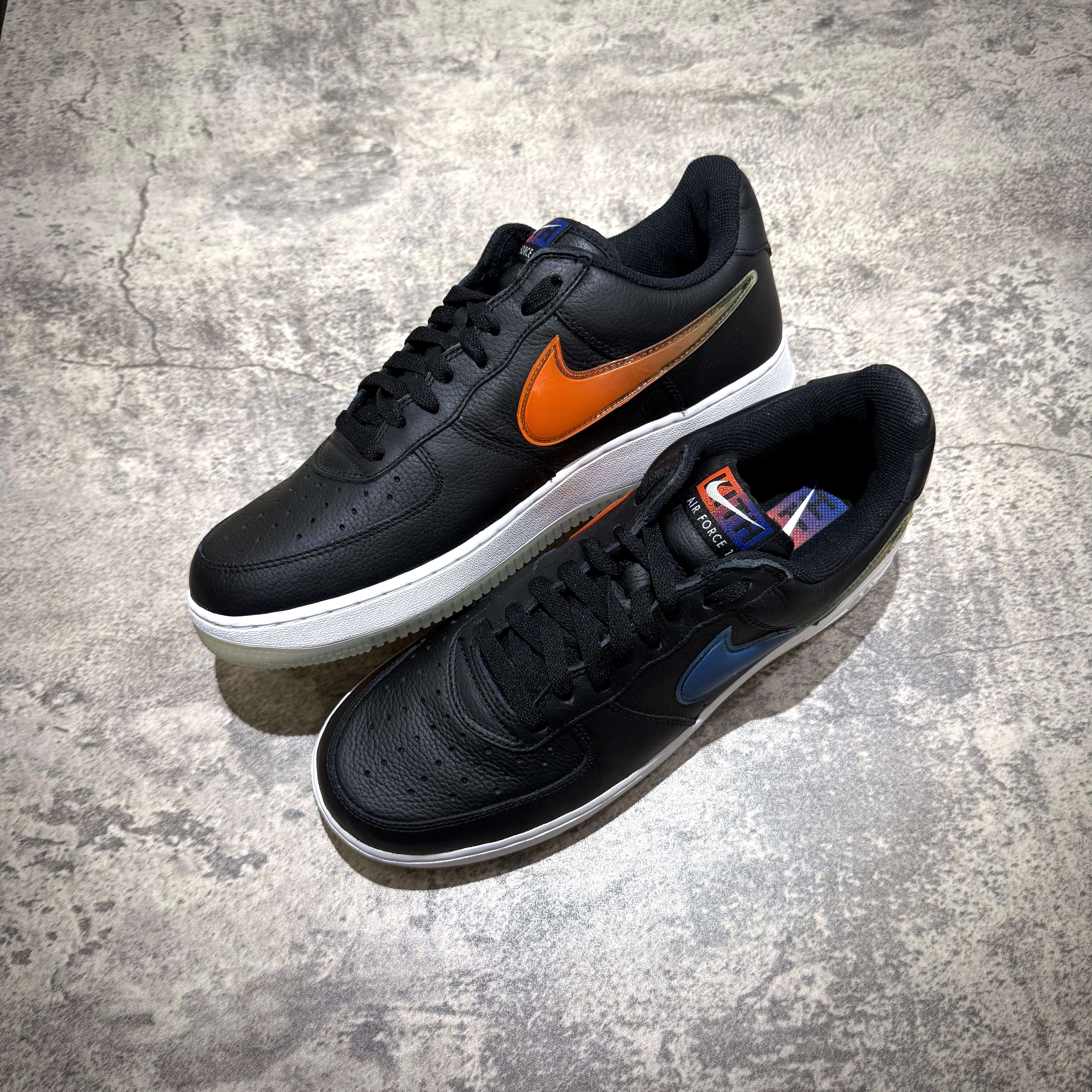 KITH x Nike Air Force 1 Low Knicks in black with orange and blue logo accents, featuring a stylish design and comfortable fit.
