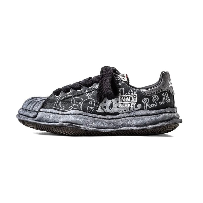 MMY BLAKEY Graffiti Printed Canvas Low sneaker showcasing unique designs and stylish black color.