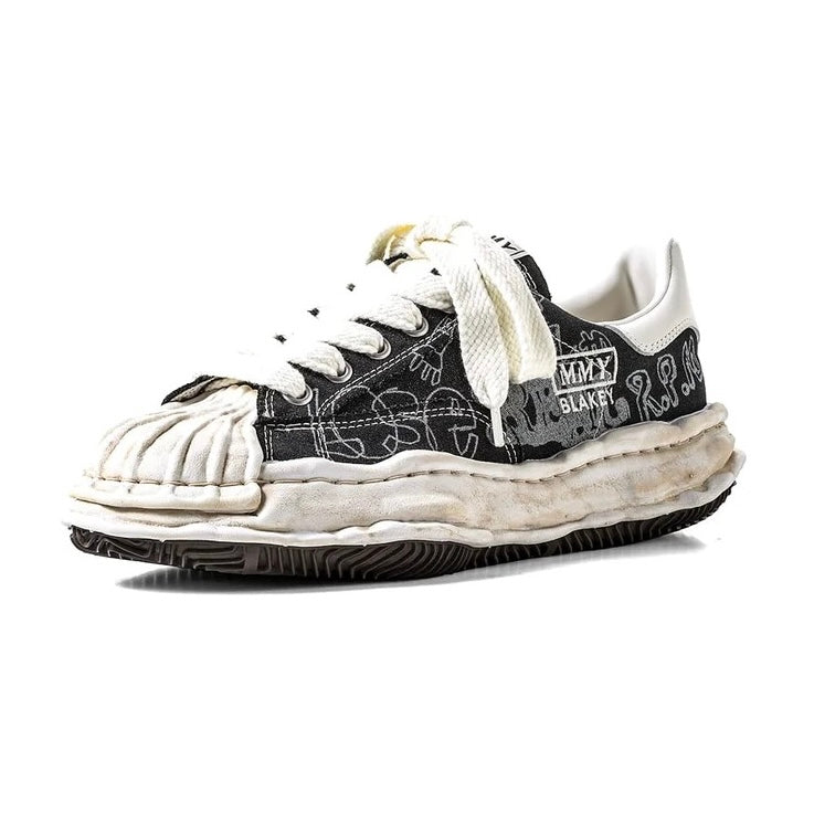 MMY BLAKEY Graffiti Printed Canvas Low sneaker showcasing unique design and detail.