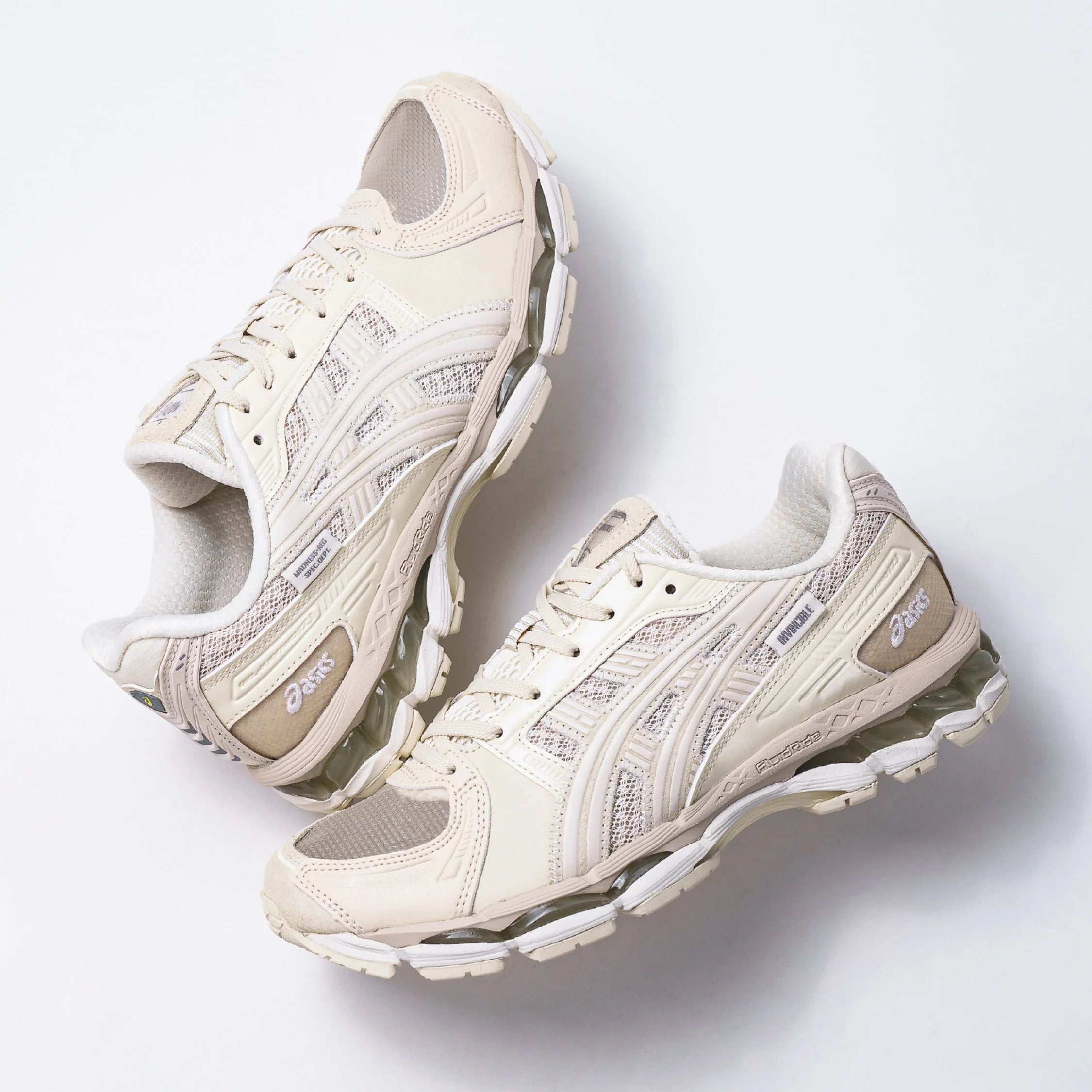 Madness x Invincible x Asics Gel-Kayano 12.1 Vanilla sneakers on a white background