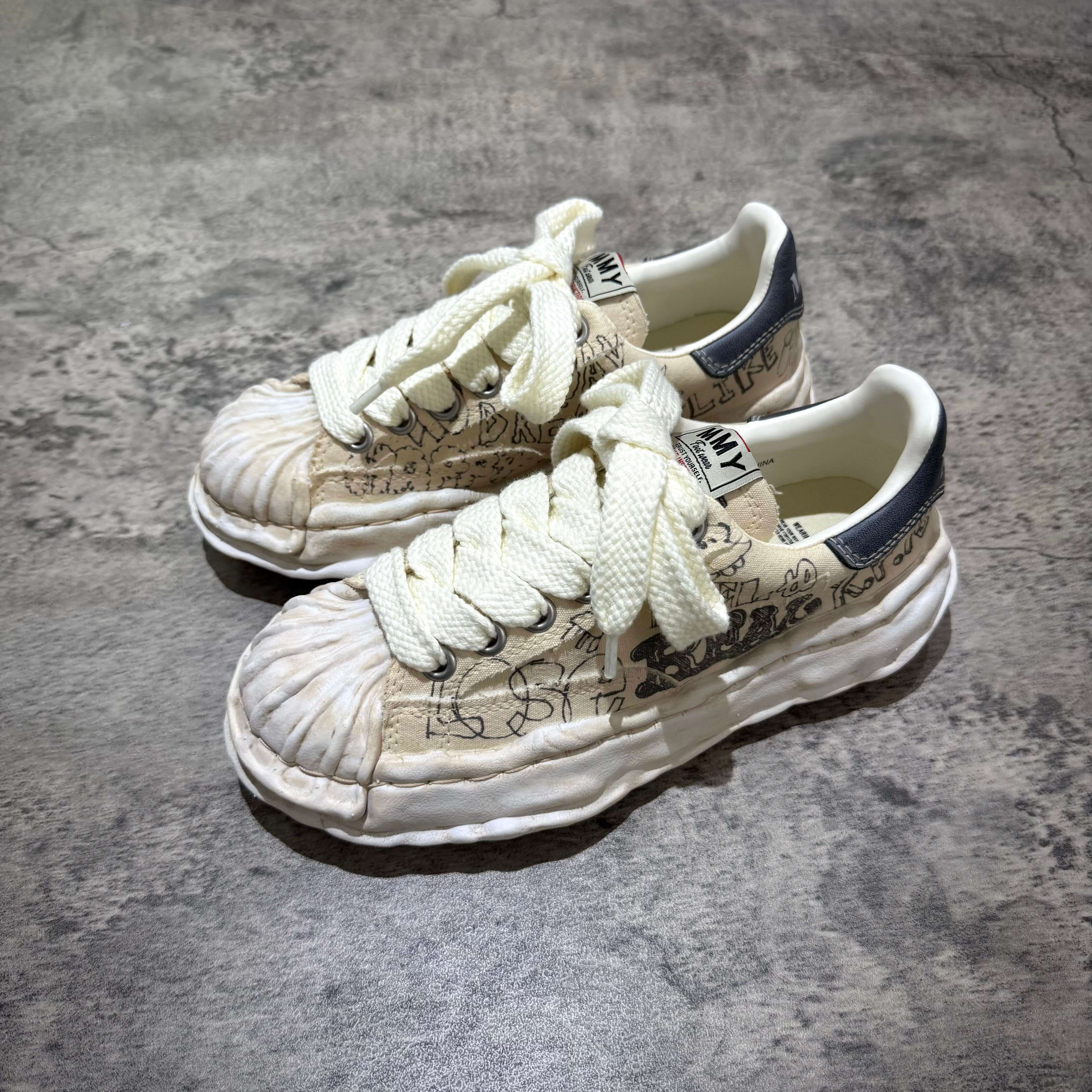 MMY BLAKEY Graffiti Printed Canvas Low sneaker with white laces and unique artwork on upper.