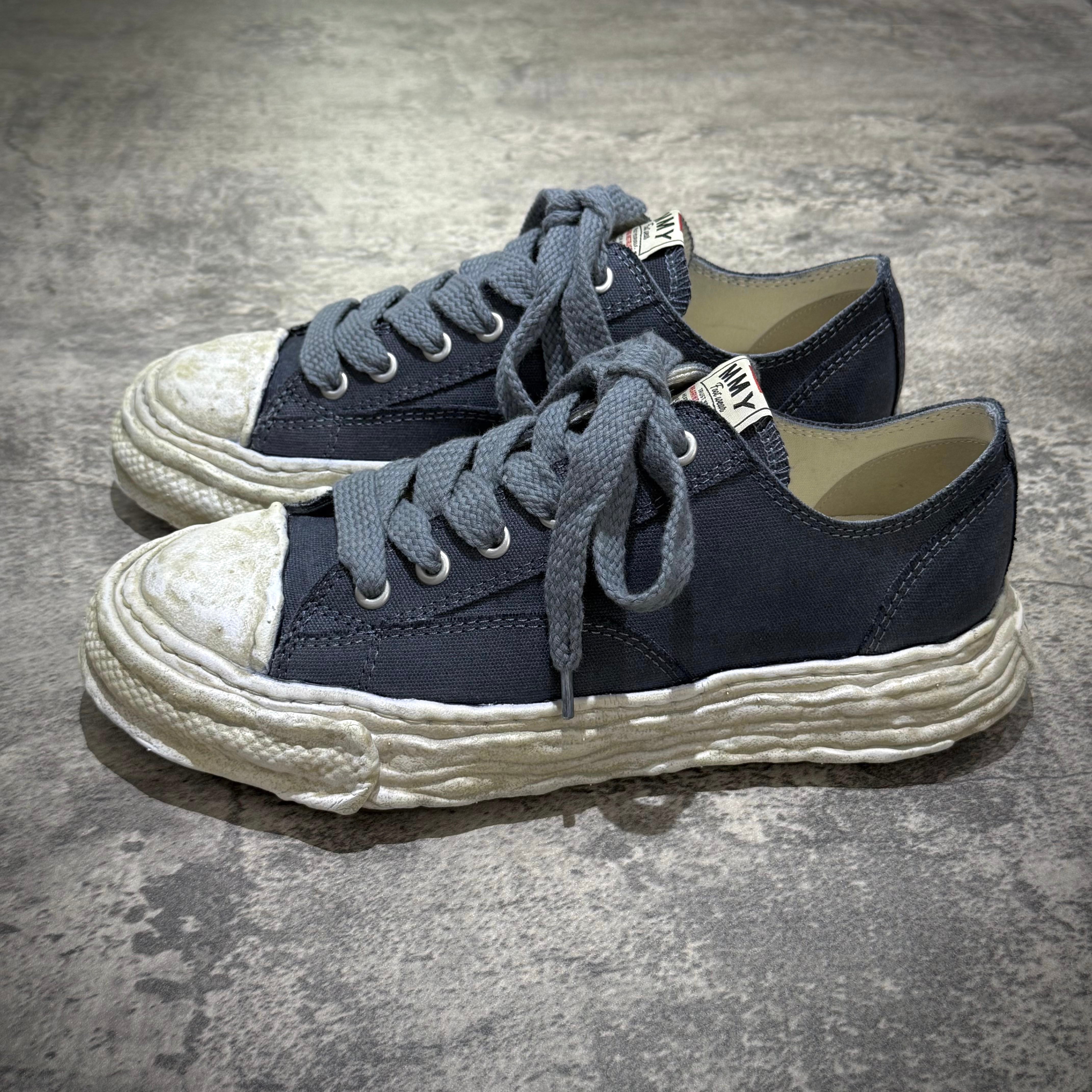 MMY PETERSON 23 OG Canvas Garment Dyed - Black shoes on a textured surface, featuring a worn look.