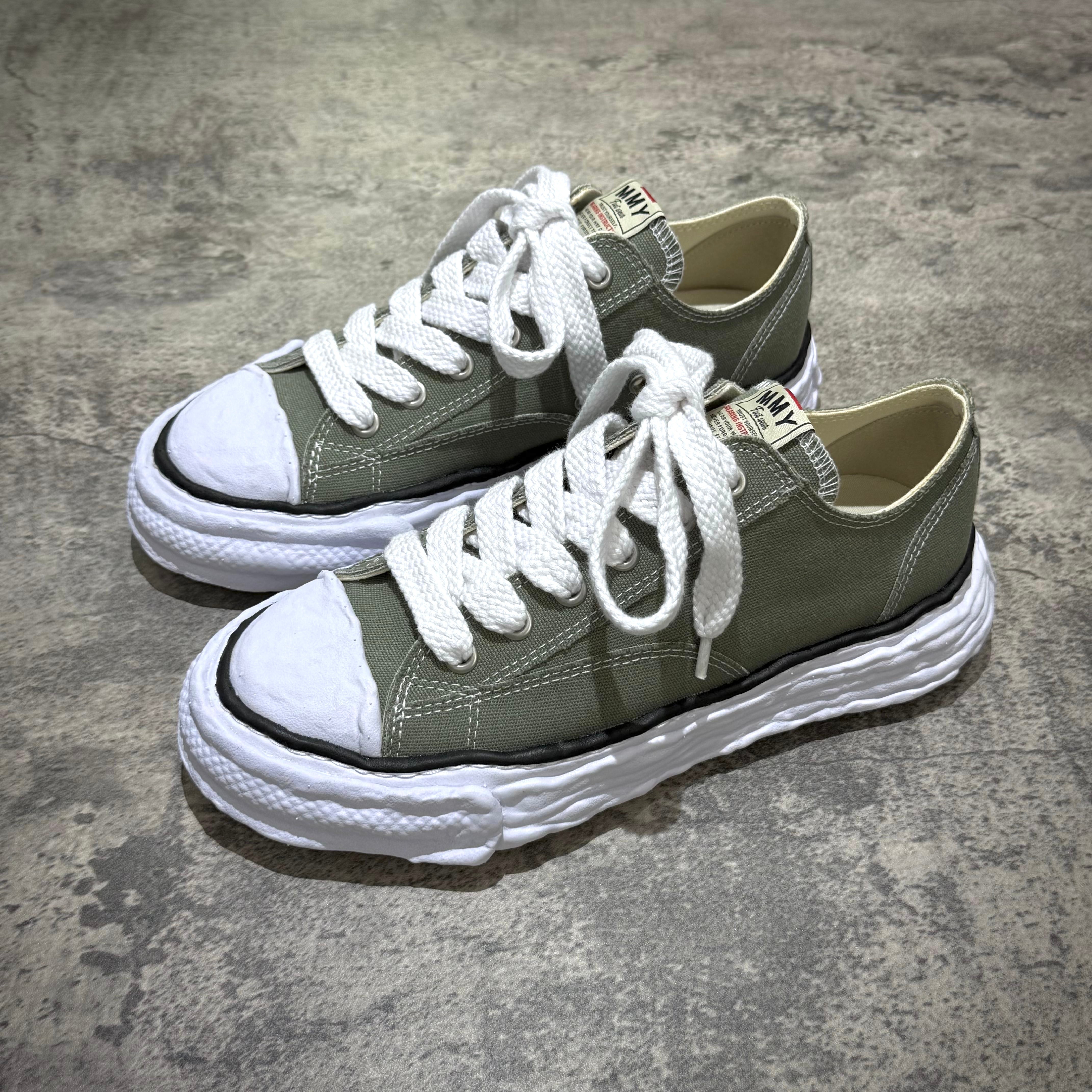 MMY PETERSON 23 OG Canvas - Green shoes with white laces and rubber soles, displayed on a gray surface.