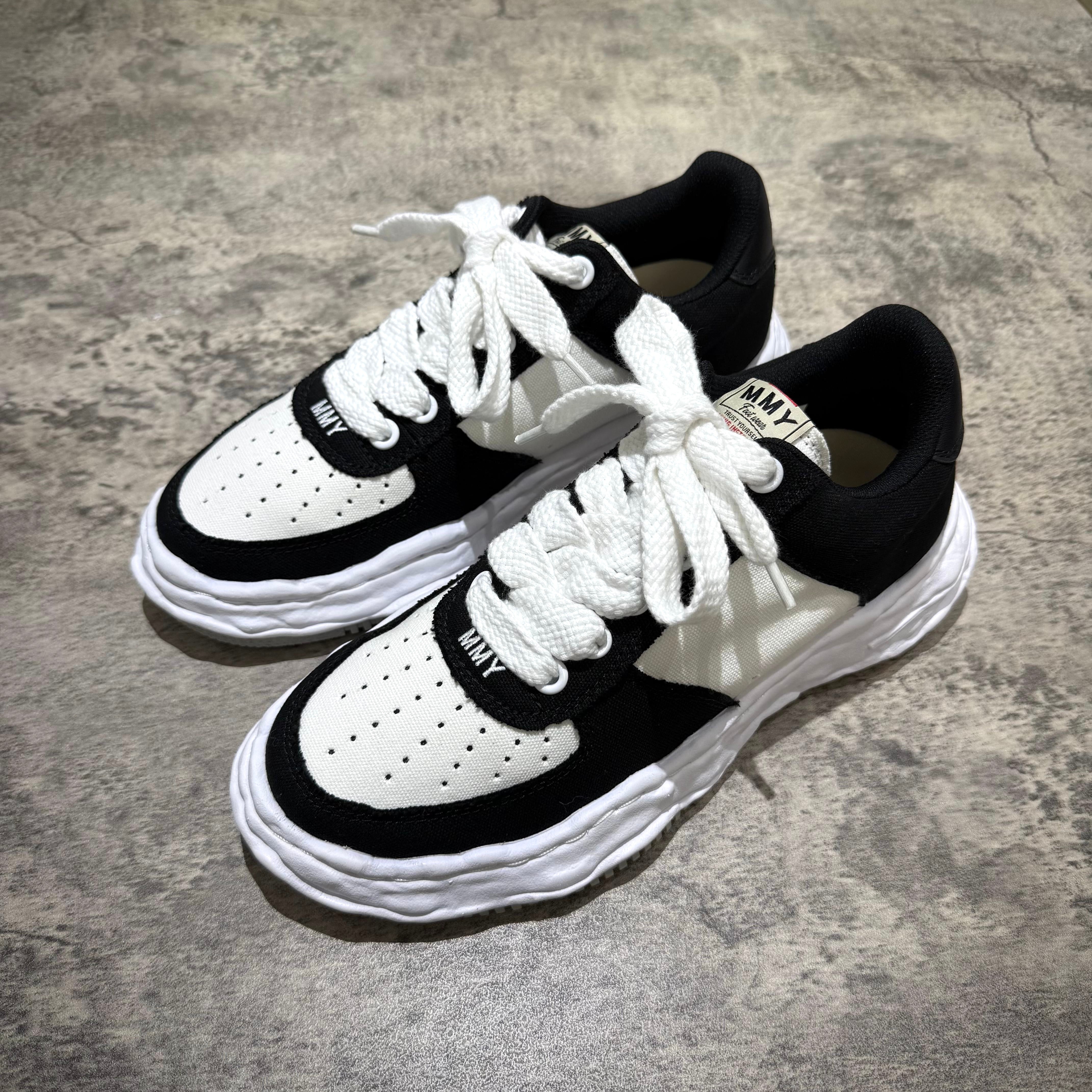 MMY WAYNE OG Canvas sneakers in black and white, featuring oversized design and unique perforated pattern.