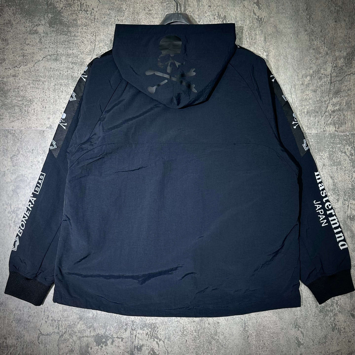 Back view of the Mastermind Japan x Bonera Stretch Anthem Jacket showcasing its design and navy color.