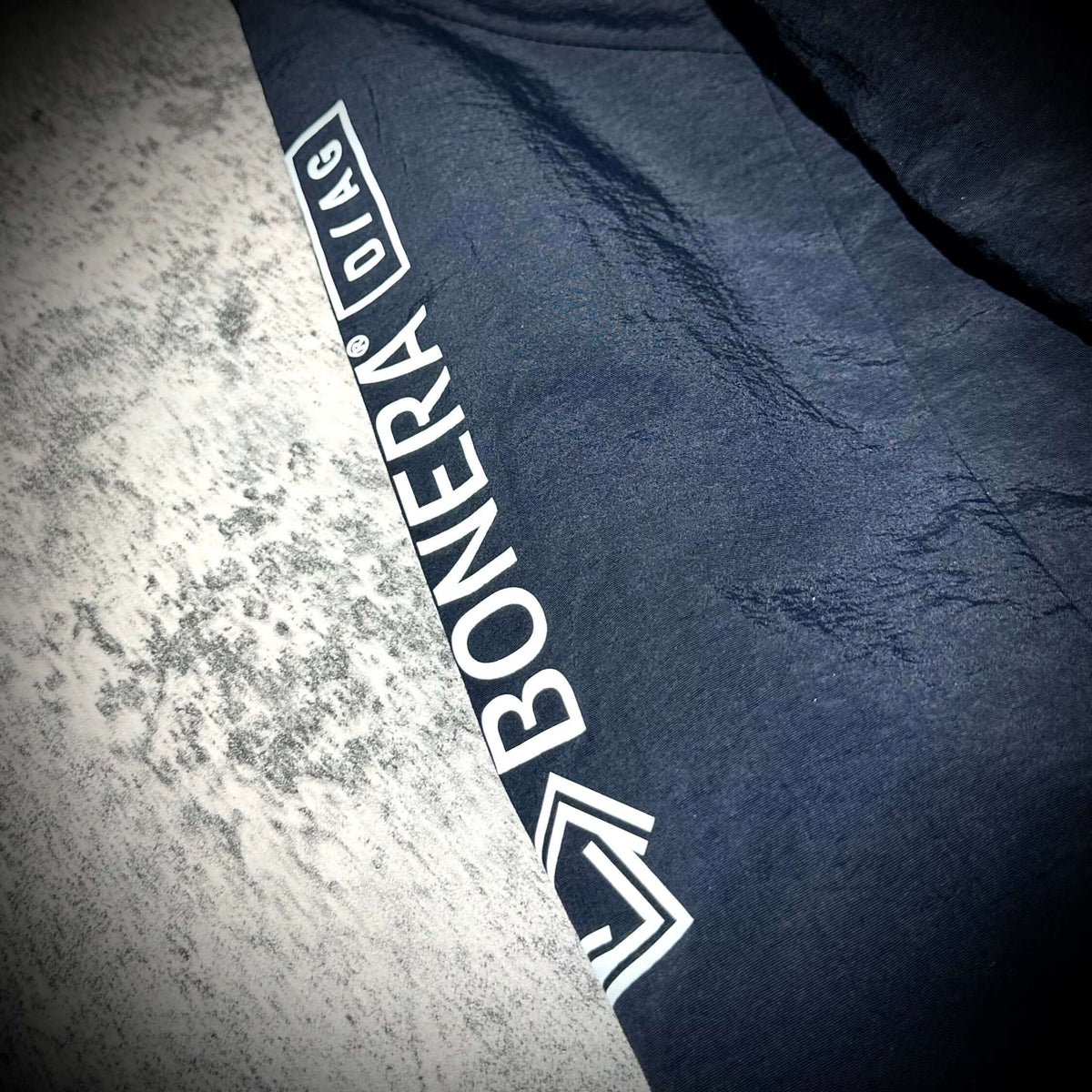 Close-up of the logo on the Bonera Stretch Anthem Jacket from Mastermind Japan.