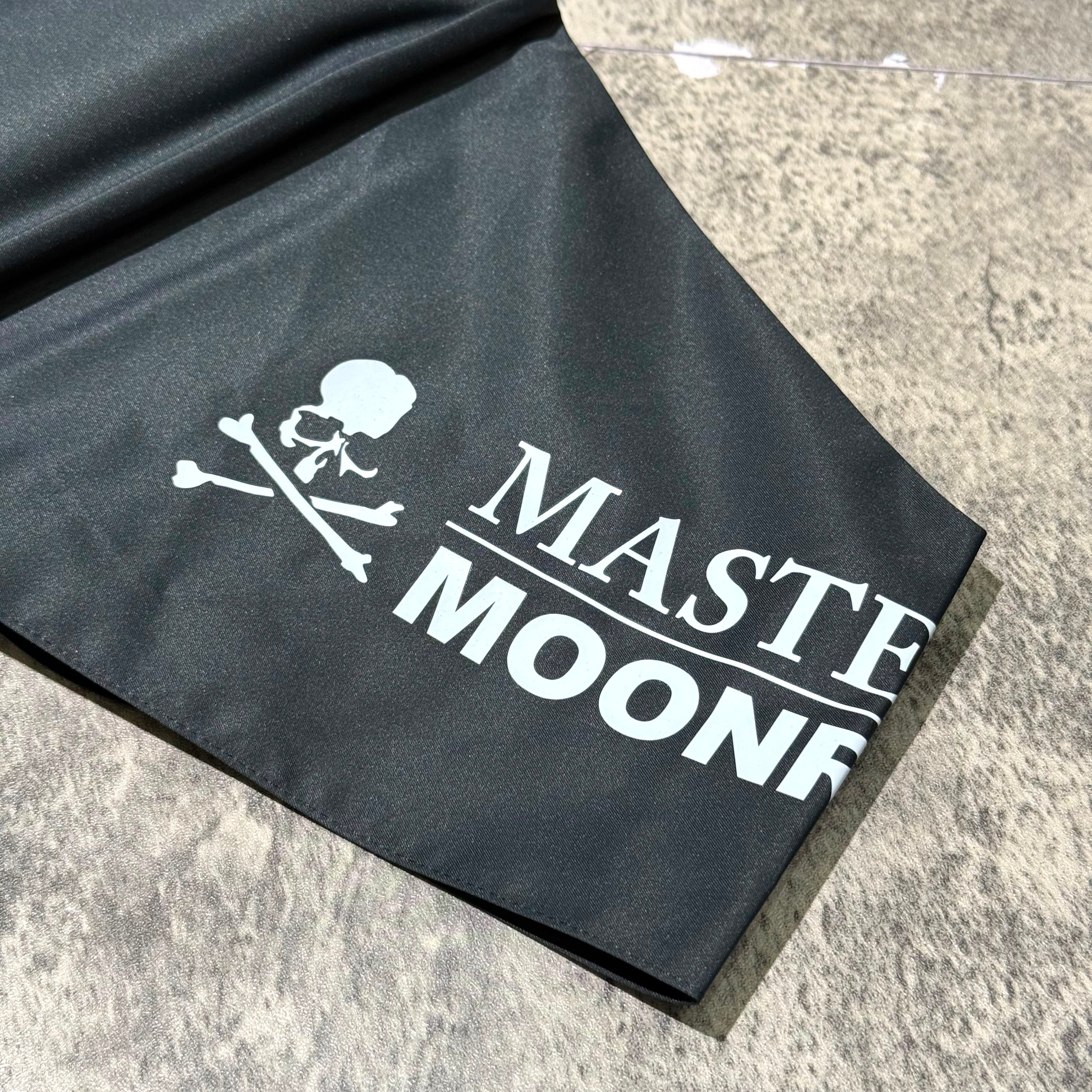 Mastermind Japan Moonrakers Umbrella fabric detail featuring logo design and skull graphic.