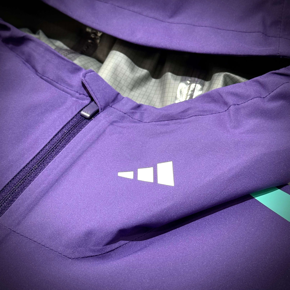 Close-up of the Mercedes-AMG Petronas Formula 1 Team Vanda Bloom Rain Jacket HZ9485 showing logo detail.