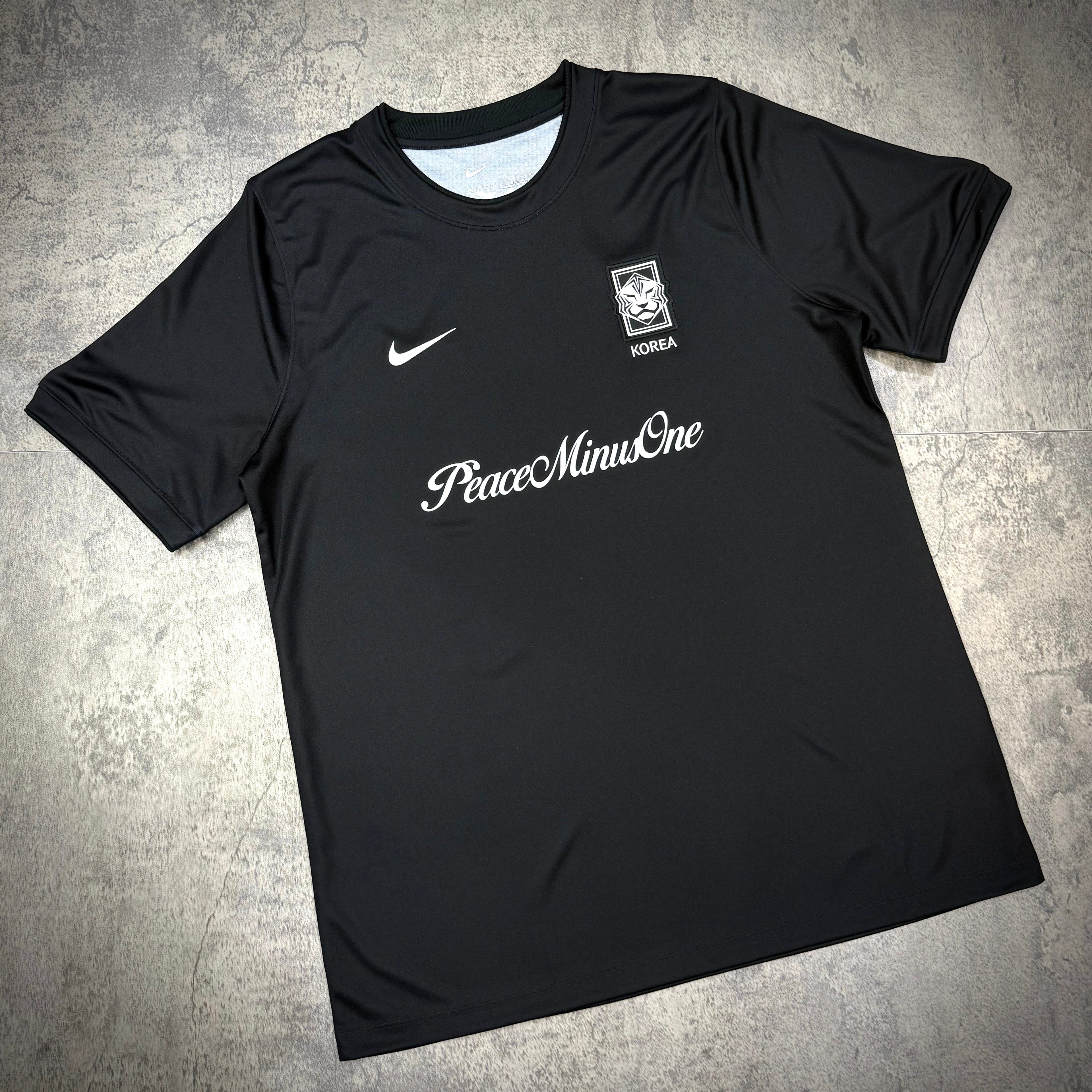 Nike x Peaceminusone x Korea KFA Academy Pro Football Top featuring PeaceminusOne logo on a black jersey.