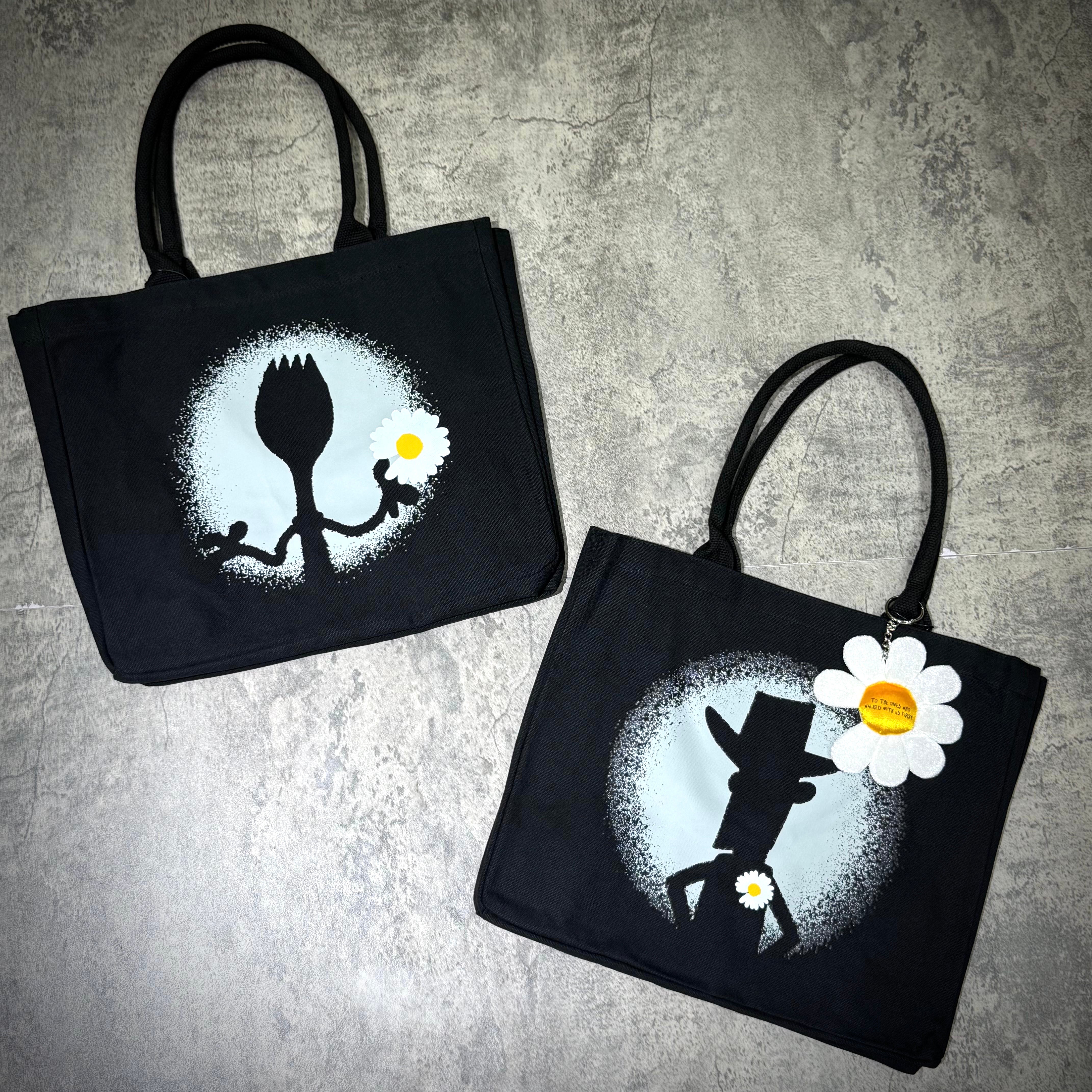 PEACEMINUSONE x Toy Story tote bag featuring Forky and Woody designs on a black background.