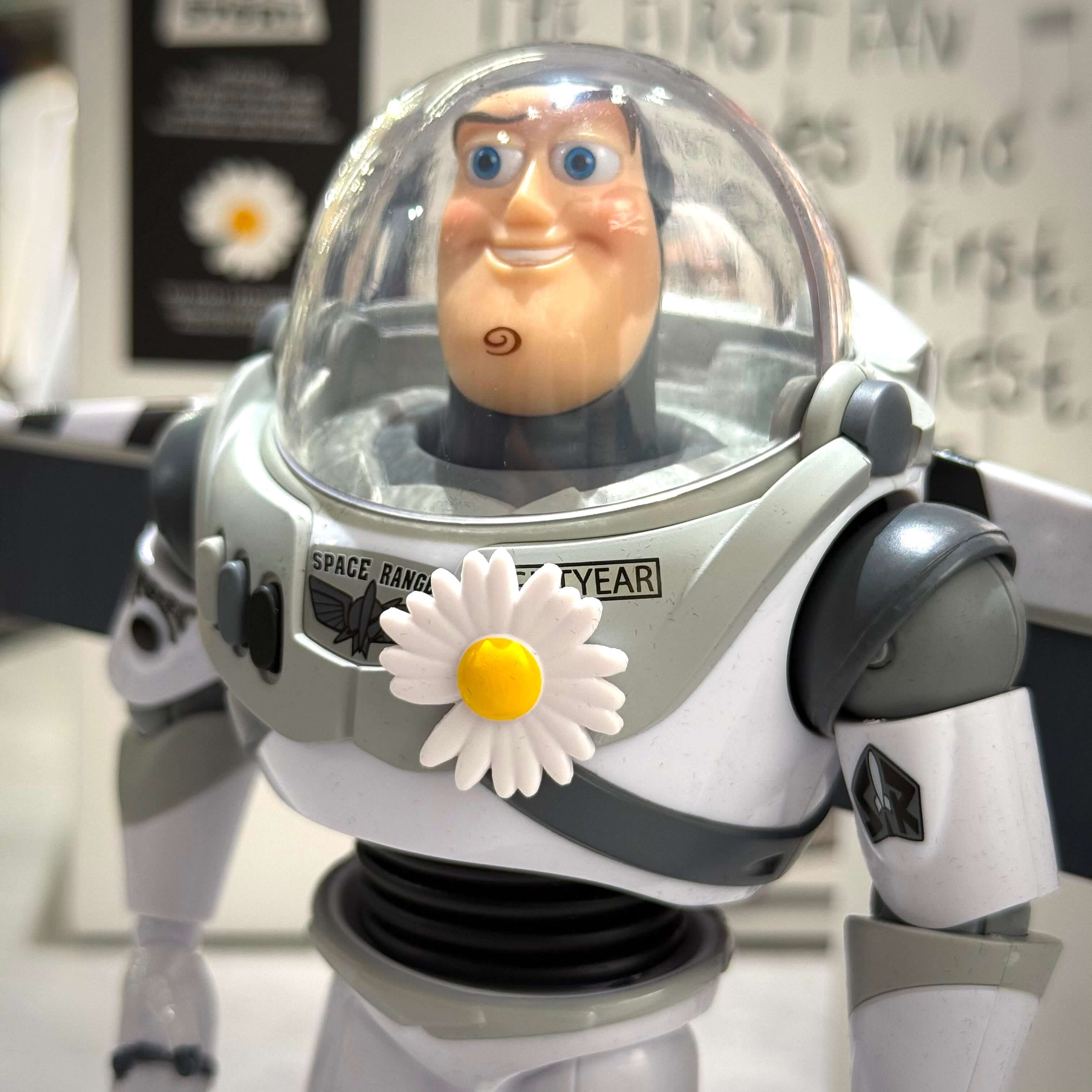 PEACEMINUSONE x Toy Story The First Fan - Action Figure Buzz with a daisy on his chest