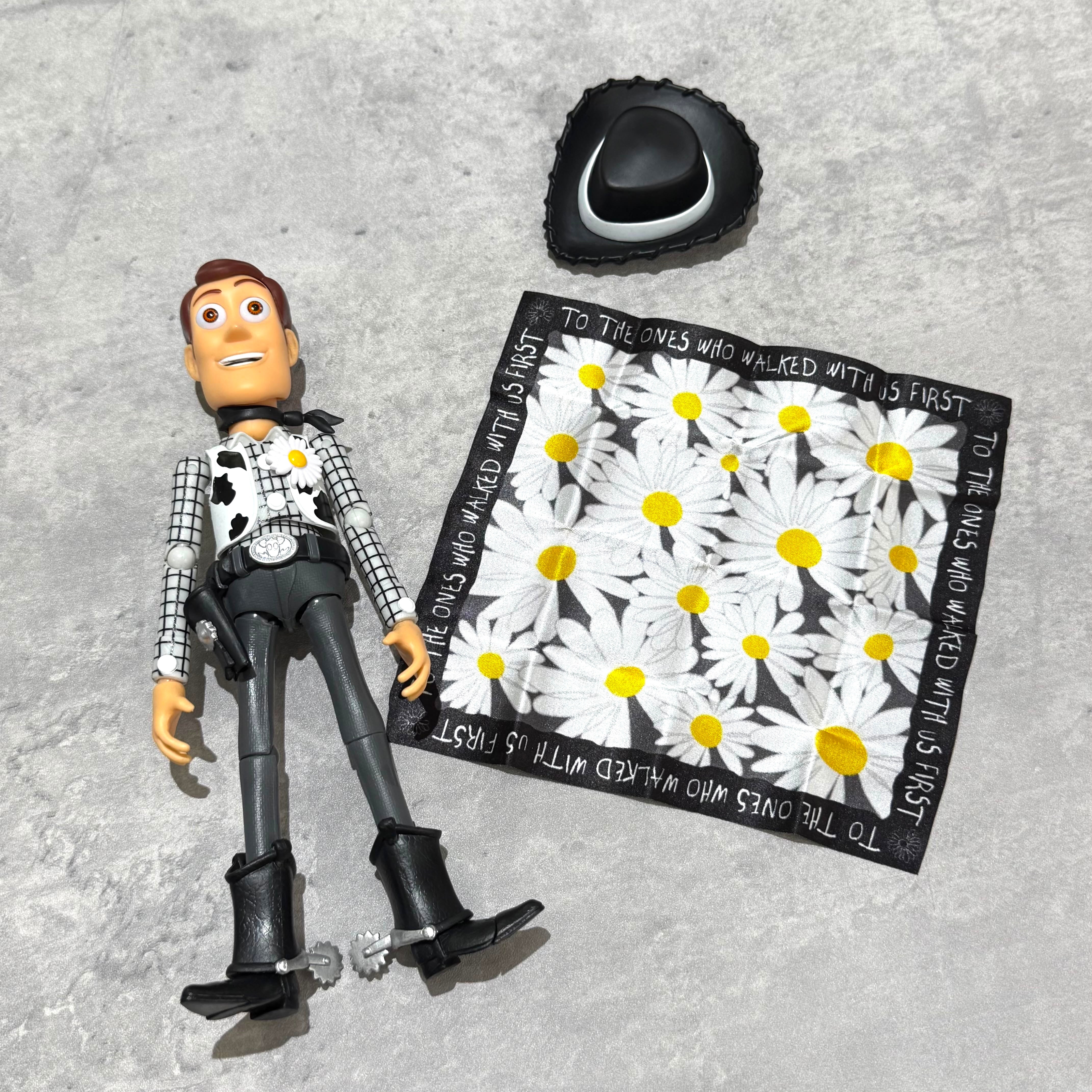 PEACEMINUSONE x Toy Story The First Fan - Action Figure Woody with accessories including a floral bandana.