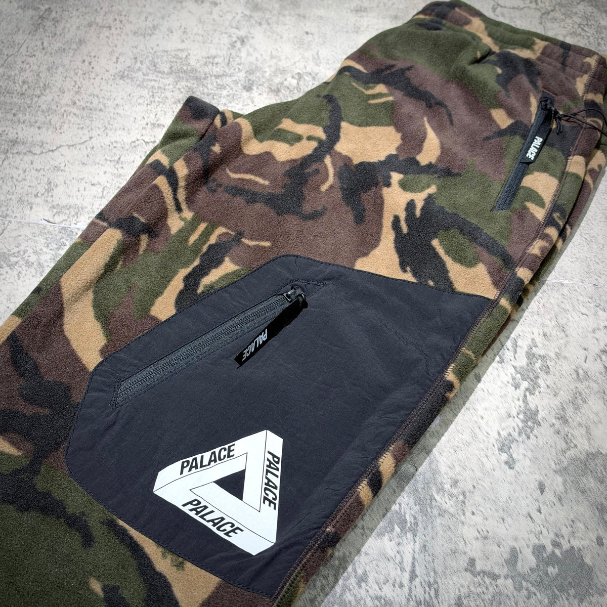 Palace P-Surgent Fleece Joggers Black DPM featuring camo pattern and branded logo pockets.