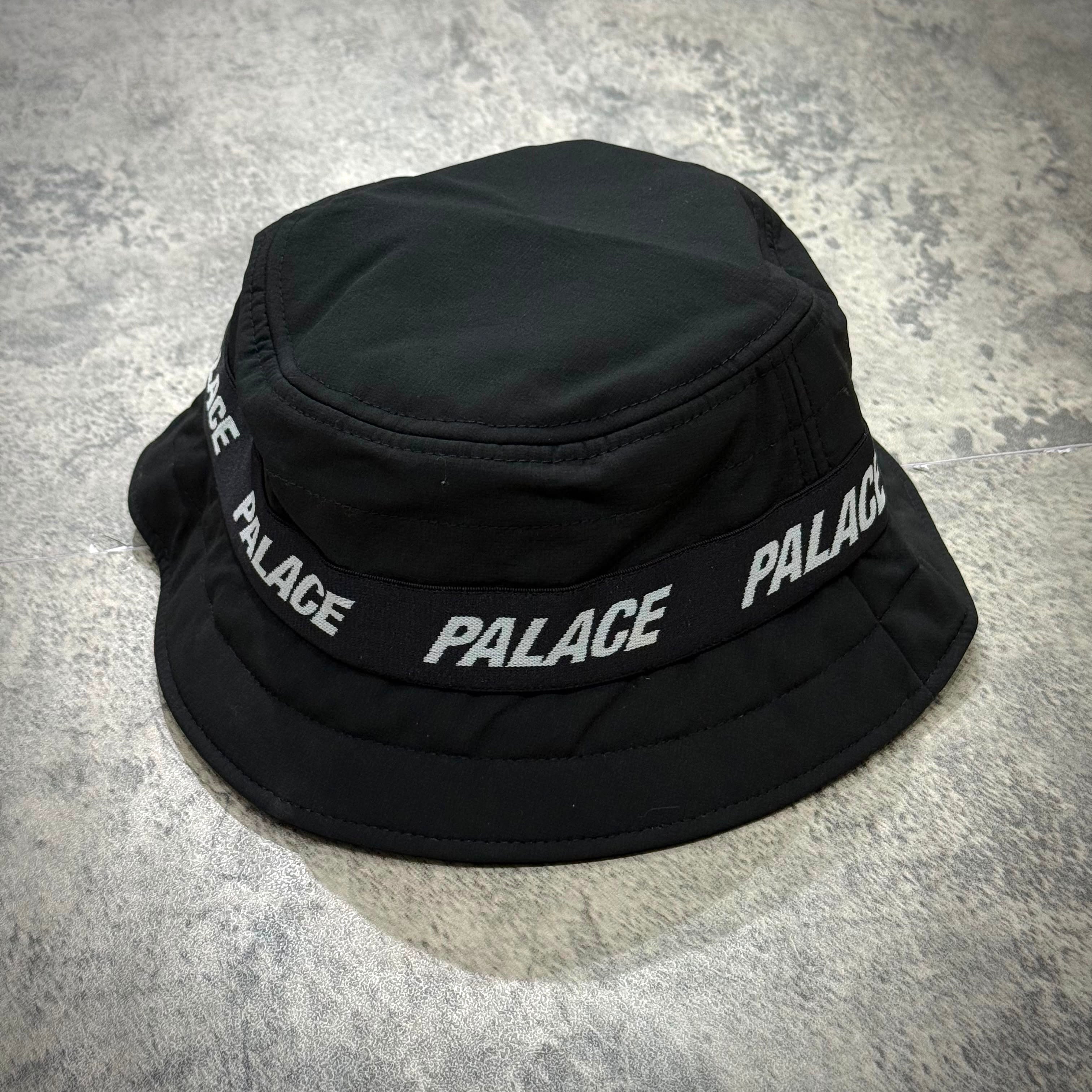 Palace Puffa Bucket - Black on a gray background, showcasing its unique design and stylish logo.