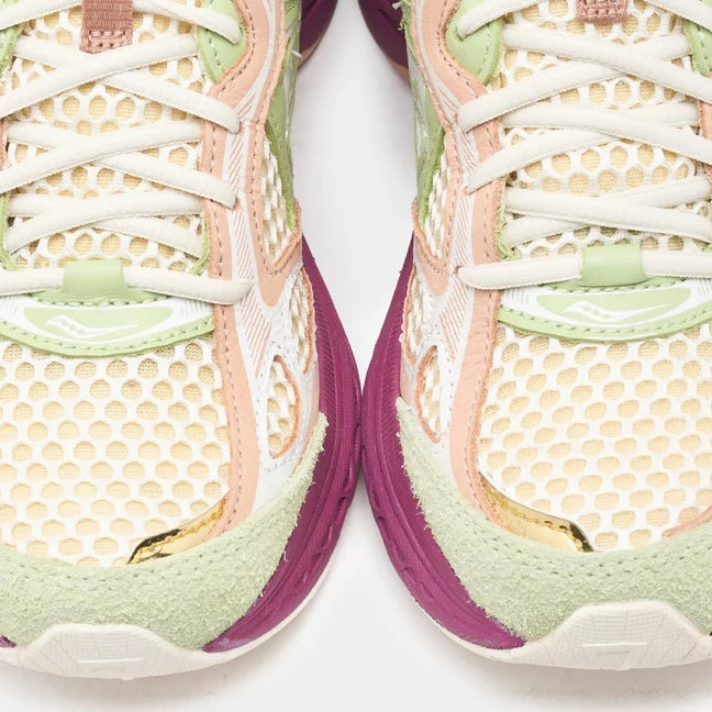 Close-up of Saucony x Stan Birch ProGrid Guide 7 running shoes showcasing colorful mesh design and detailed texture.