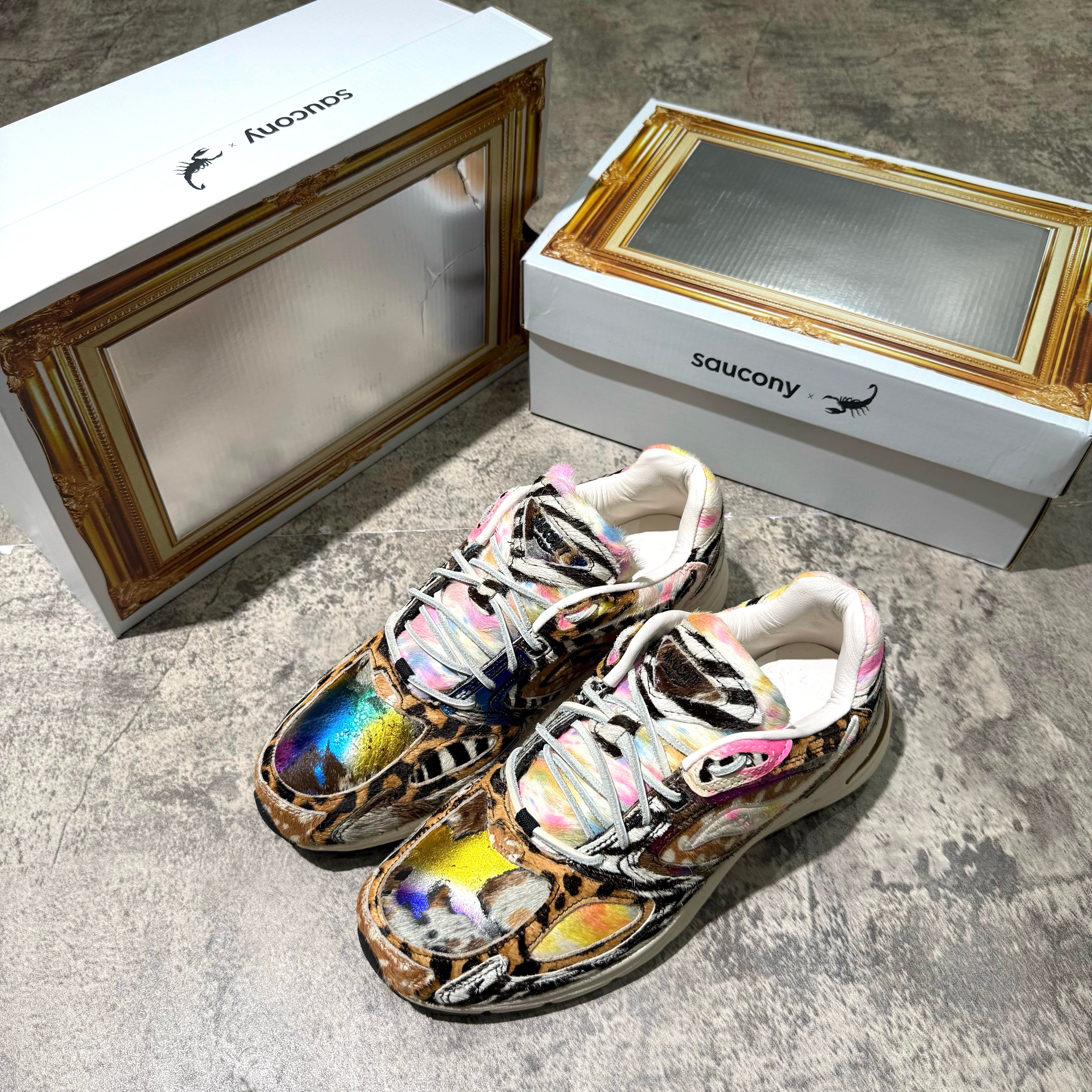 Saucony x Westside Gunn Grid Jazz 9 Awesome God sneakers in colorful design with packaging in background. wear43way