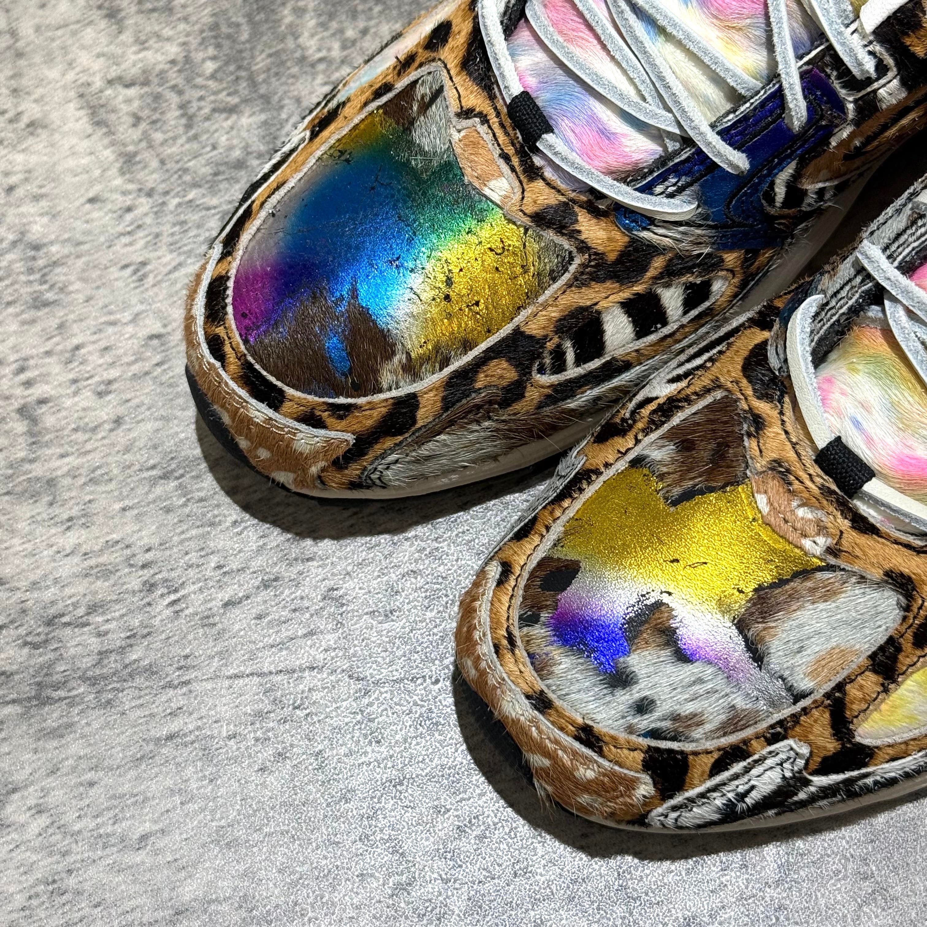 Close-up view of Saucony x Westside Gunn Grid Jazz 9 Awesome God featuring vibrant, reflective detailing on a leopard print design. wear43way