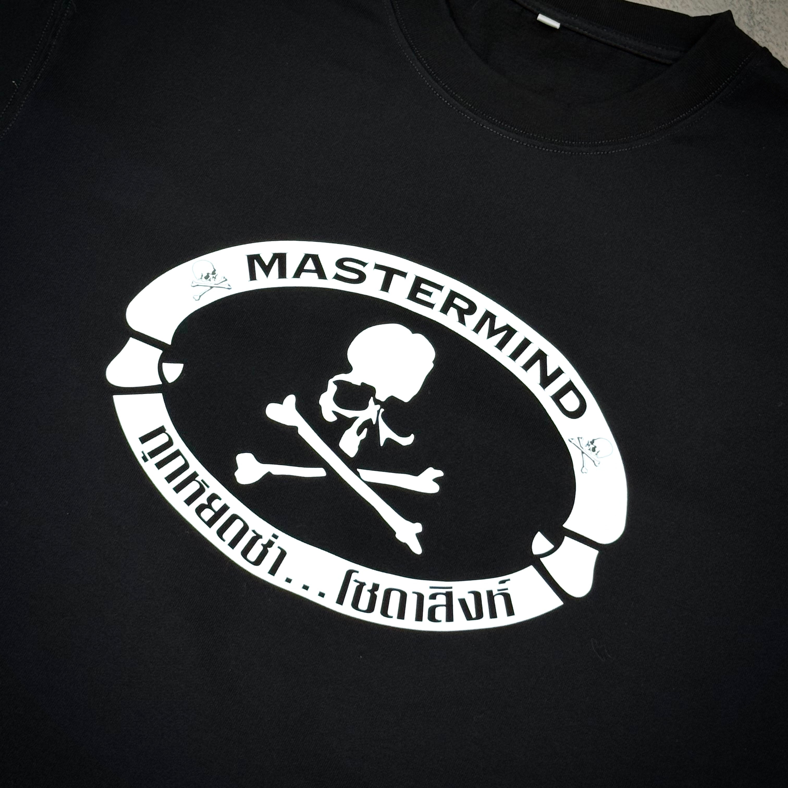 Singha Soda x Mastermind World SS Tee #1 featuring a bold black design with a skull and crossbones logo.