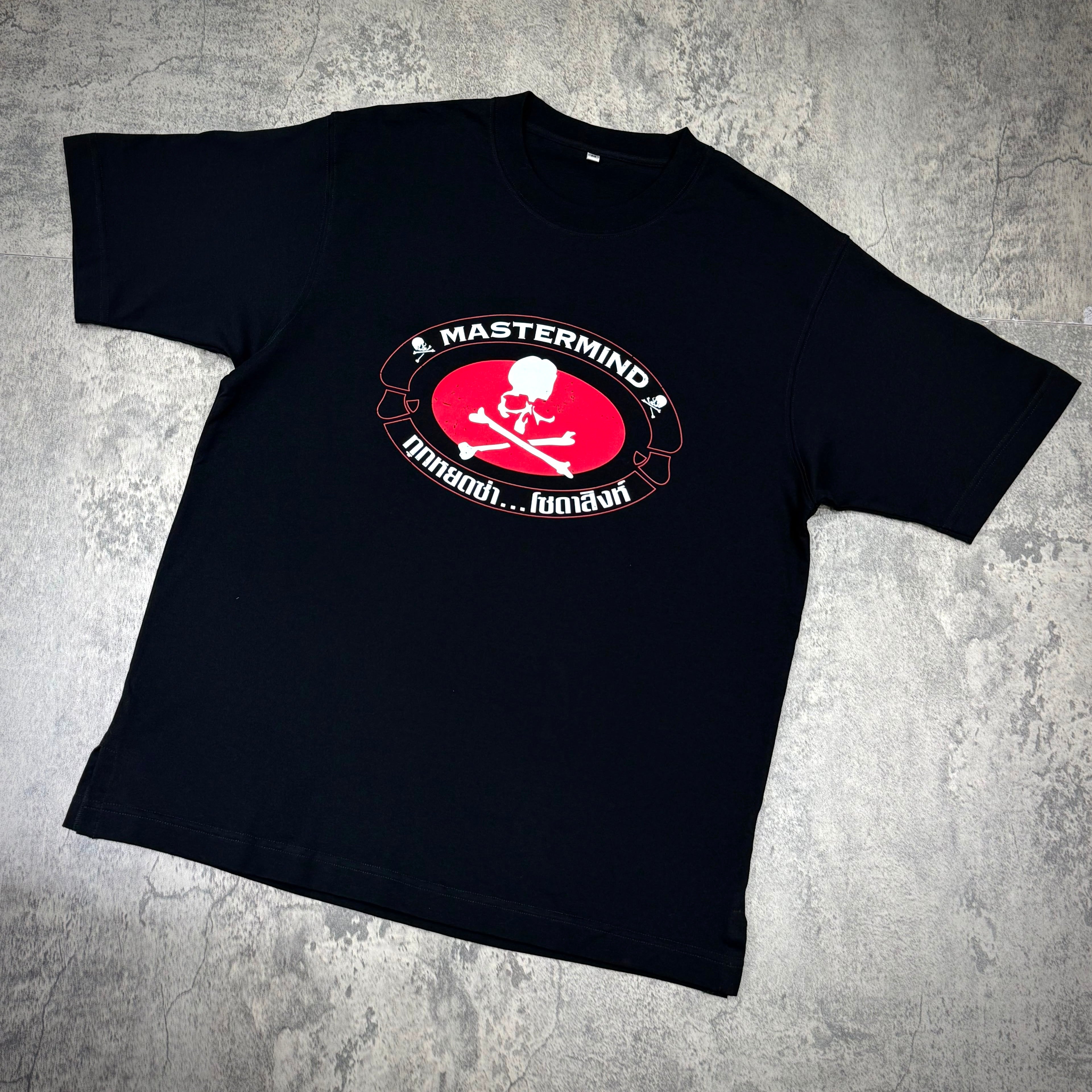 Singha Soda x Mastermind World SS Tee #2 featuring a skull and crossbones logo on a black background.
