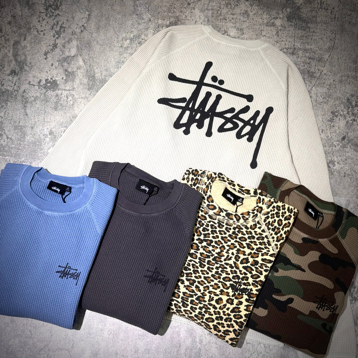 Stussy Basic Raglan Thermal LS Crew FW26 in multiple colors including blue, gray, leopard print, and camo styles.