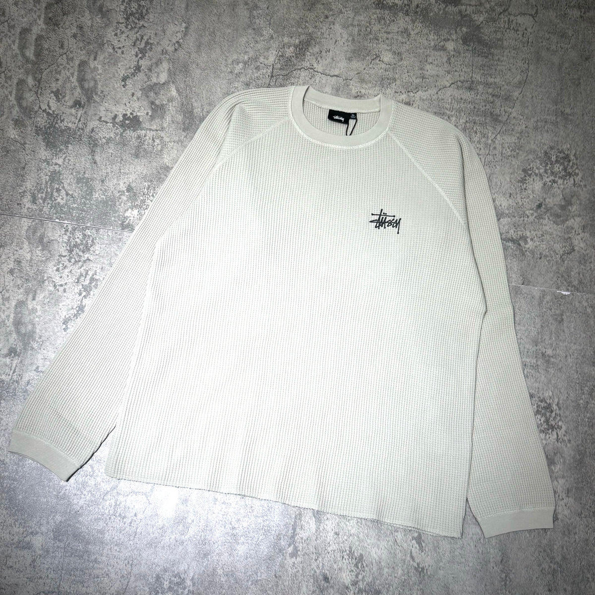 Stussy Basic Raglan Thermal LS Crew FW26 in light green, featuring a ribbed texture and the Stussy logo.