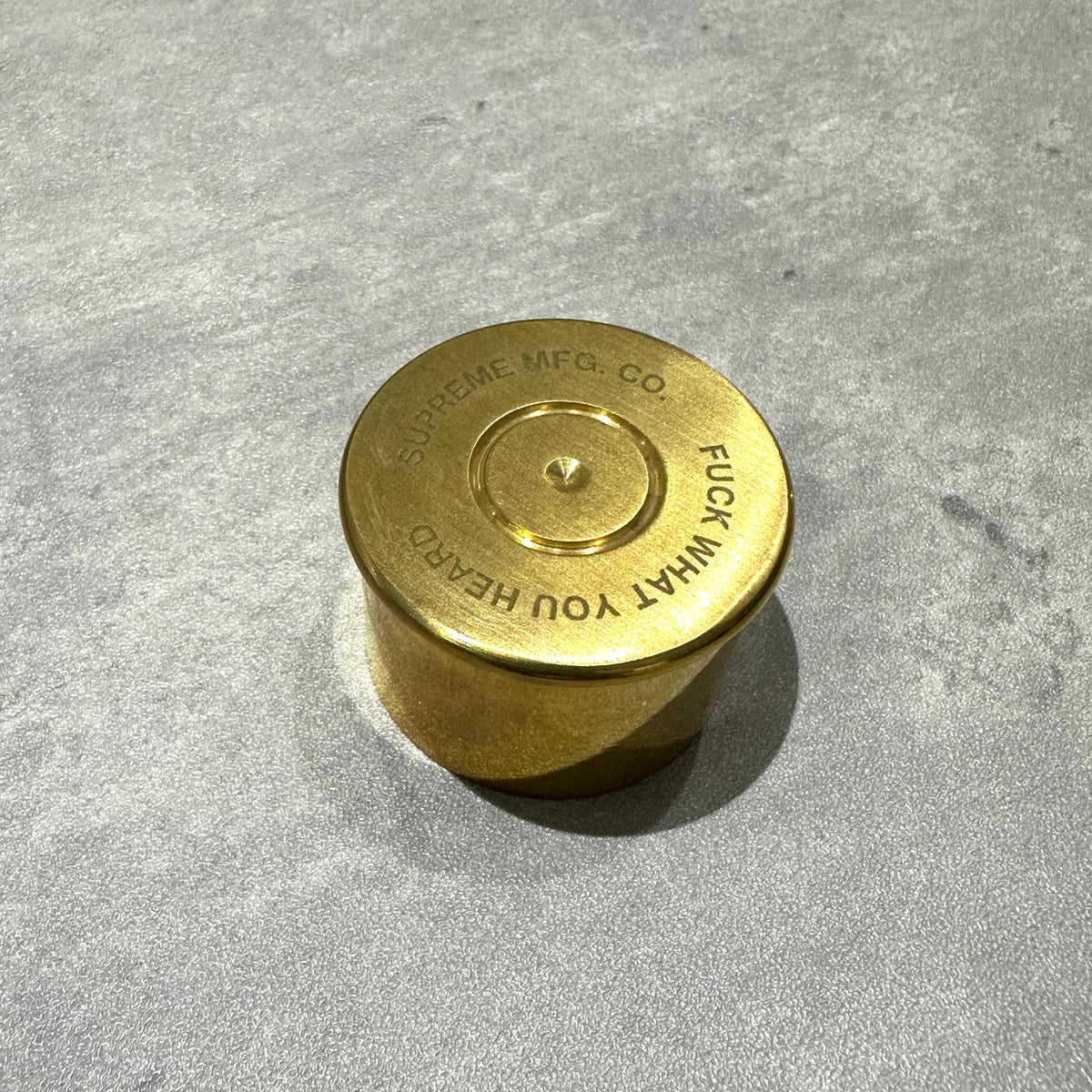 Supreme English Pewter Company Bullet Flask, gold finish, circular design with engraved text.