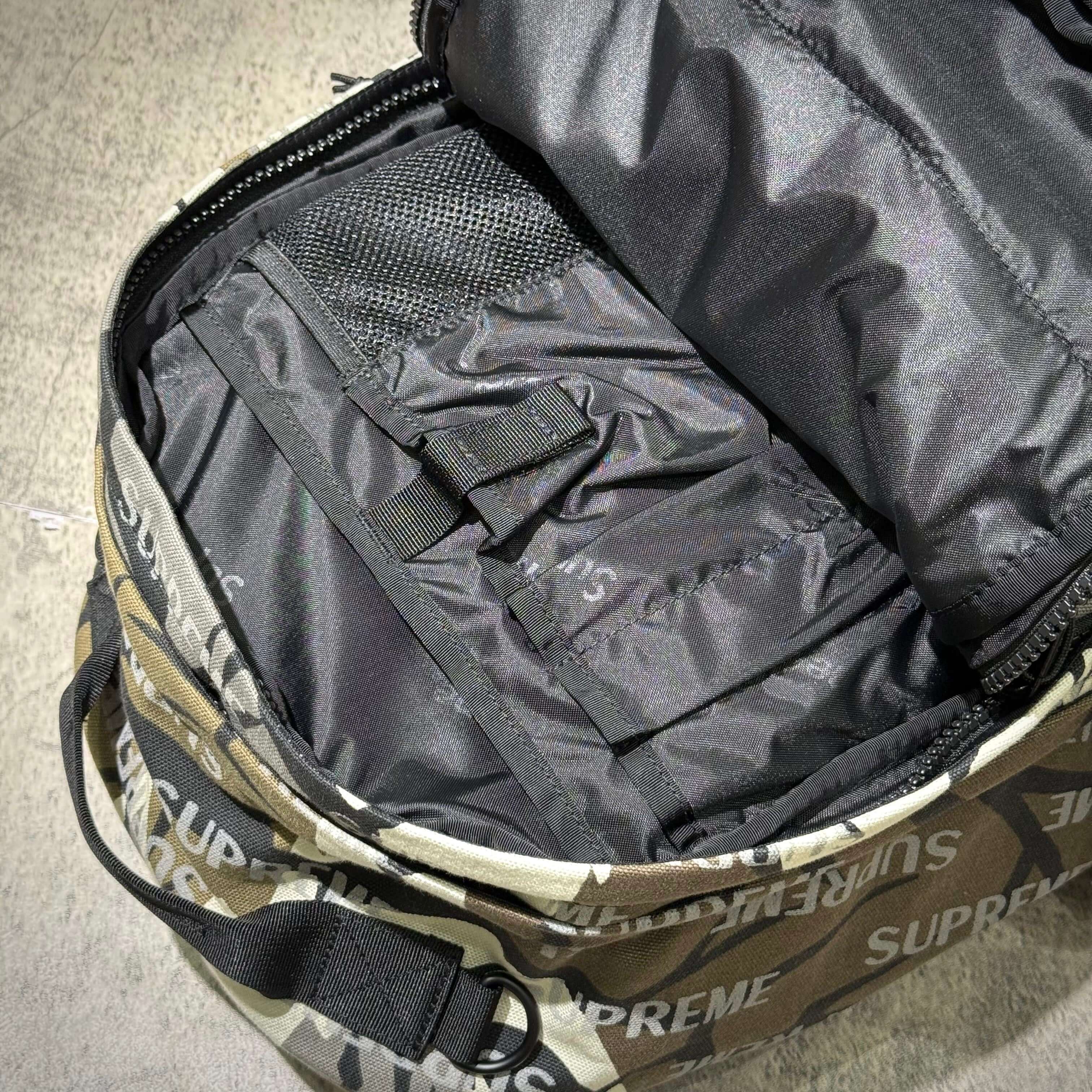 Interior view of the Supreme FW26 Backpack showcasing its spacious compartments and organization features.