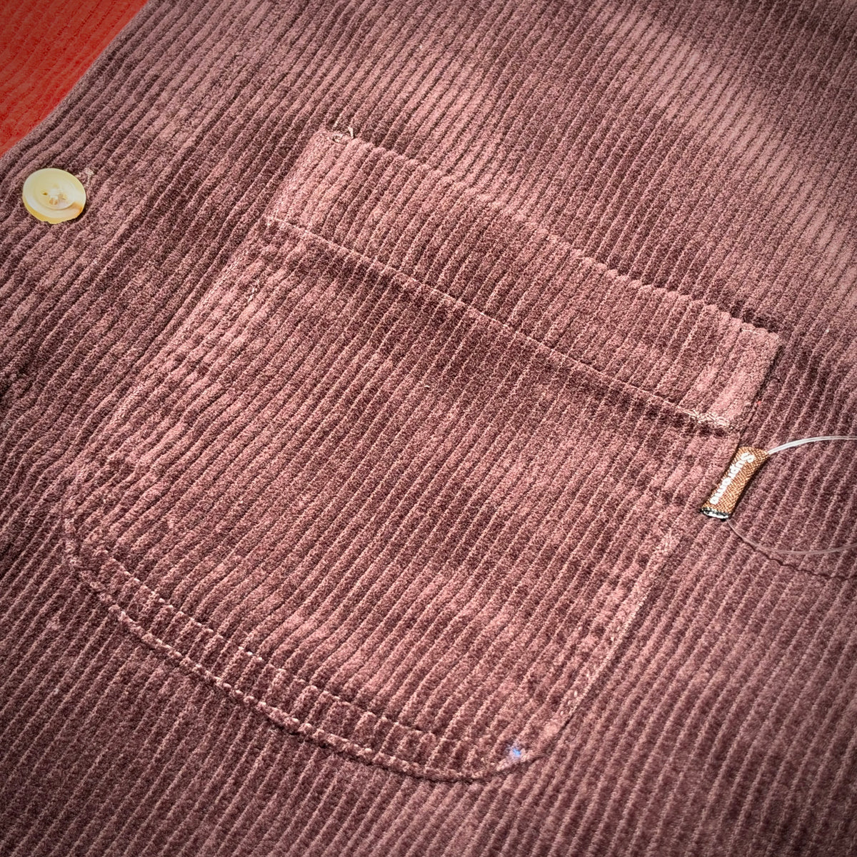 Detail view of the pocket on the Supreme Hooded Color Blocked Corduroy Shirt.