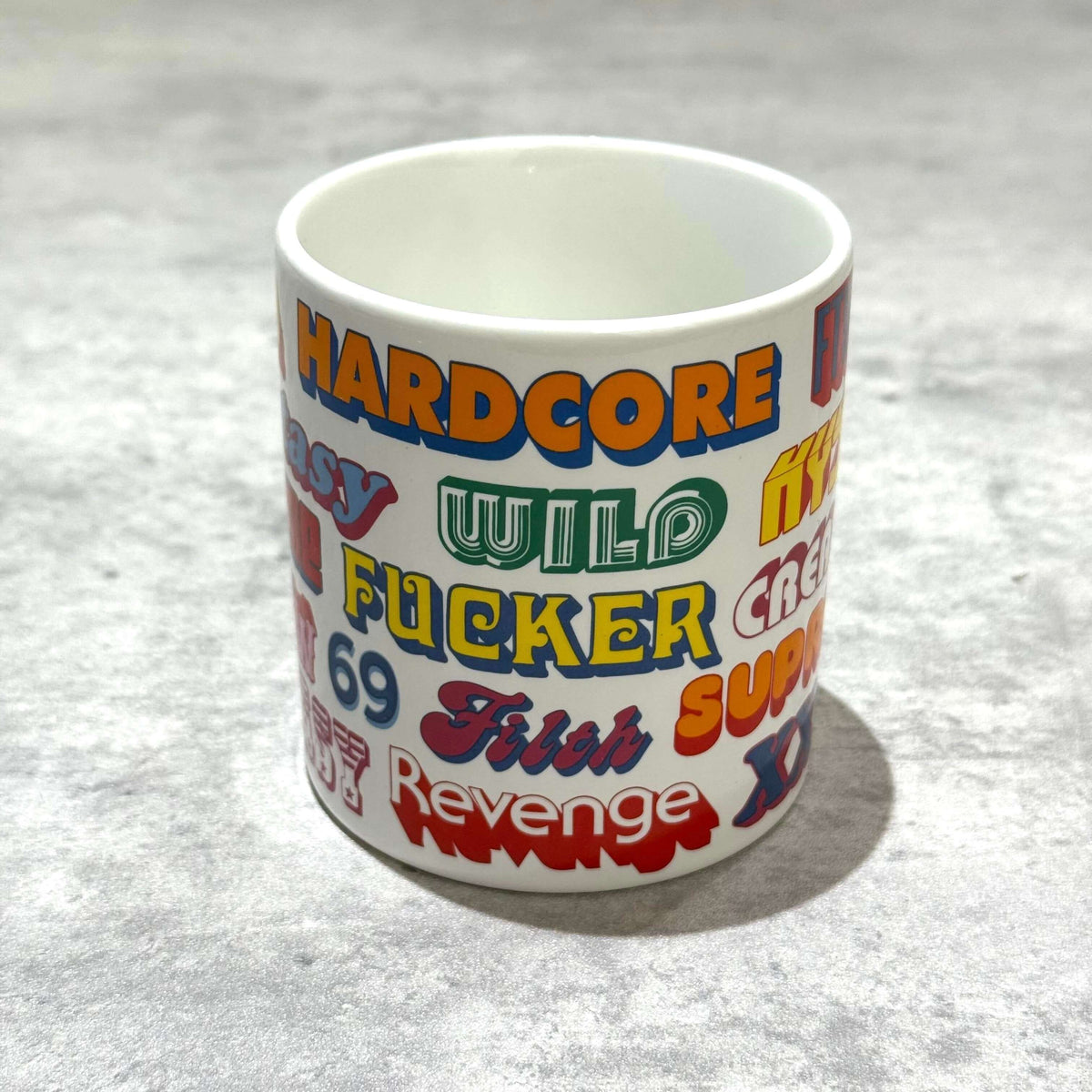 Supreme Hysteric Glamour Ceramic Coffee Mug featuring colorful graphic designs and playful text.