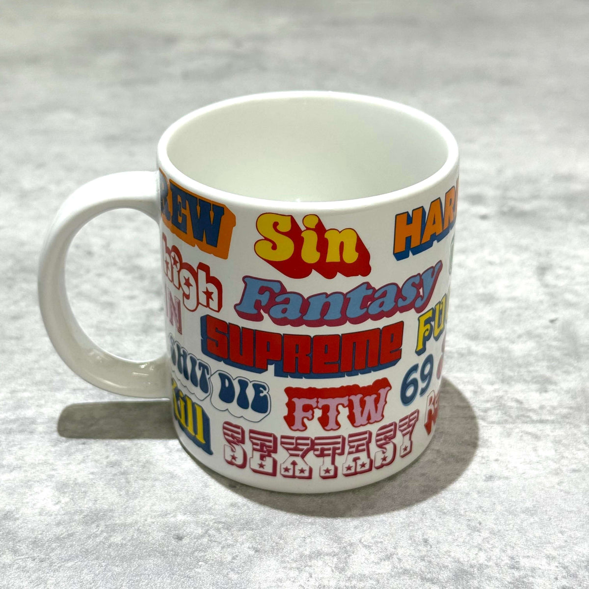 Supreme Hysteric Glamour Ceramic Coffee Mug featuring colorful logos and text designs.