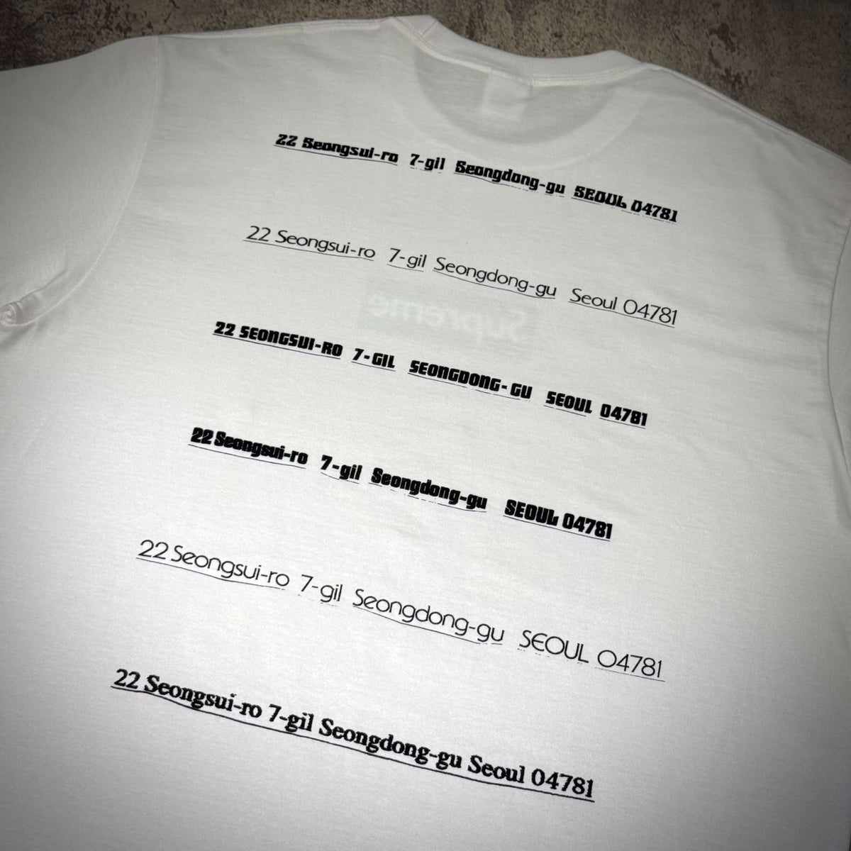 Supreme Seoul Box Logo Tee FW26 - White with printed address design on the back