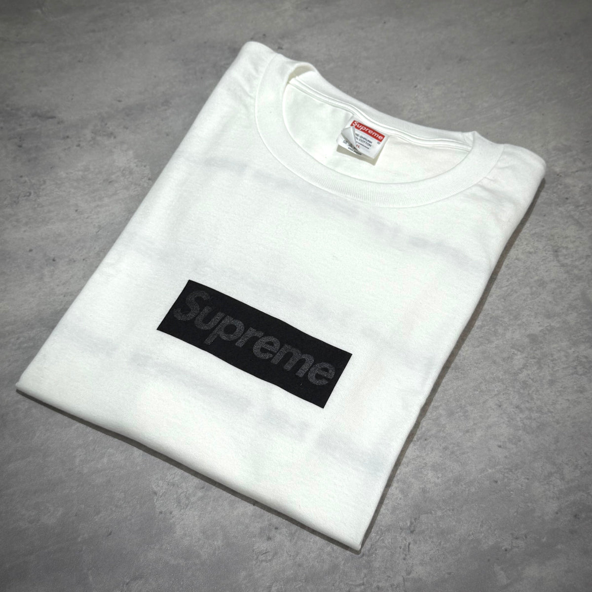 Supreme Seoul Box Logo Tee FW26 - White laid flat showing the black box logo on a white shirt.