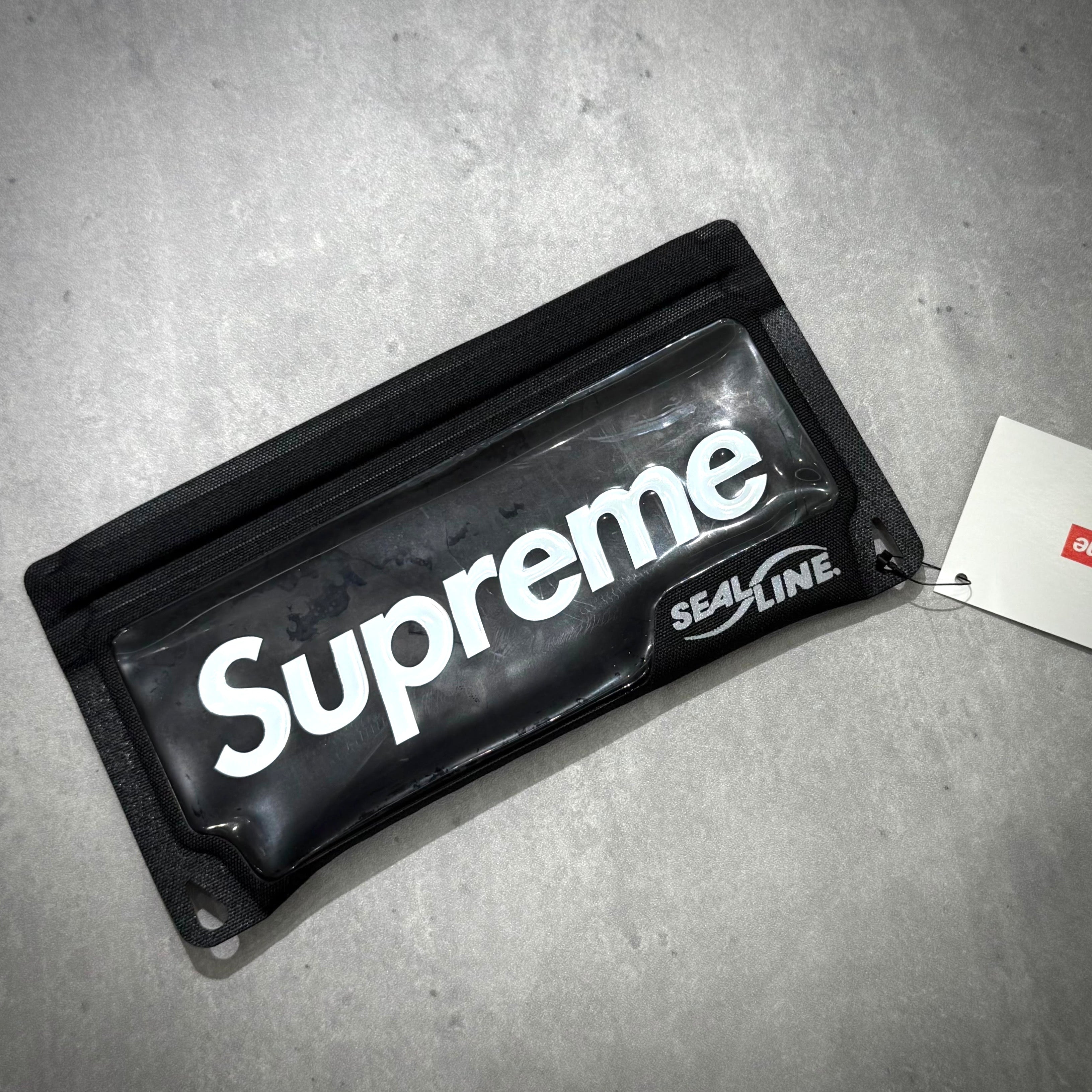 Supreme SealLine Waterproof Case displayed on a surface showing the iconic logo.