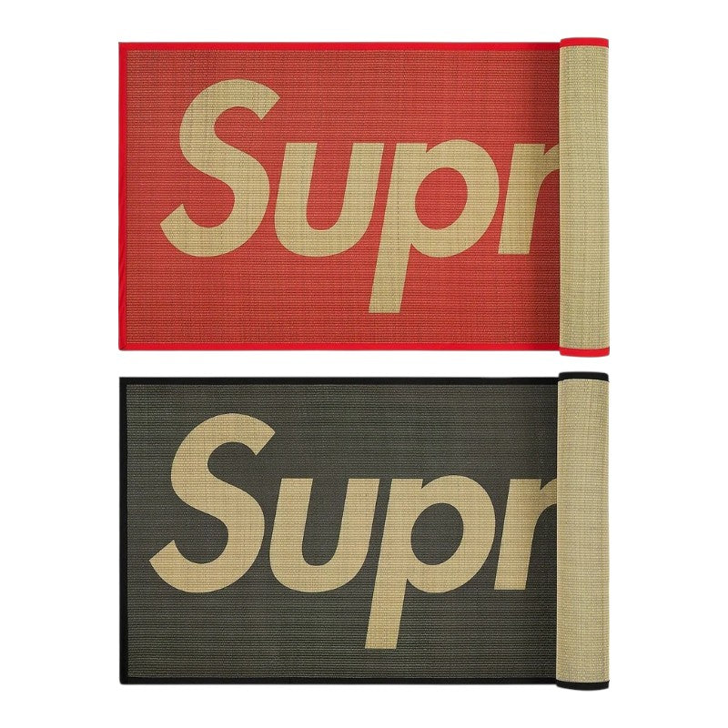 Supreme Woven Straw Mat showing red and black color options with the logo design.