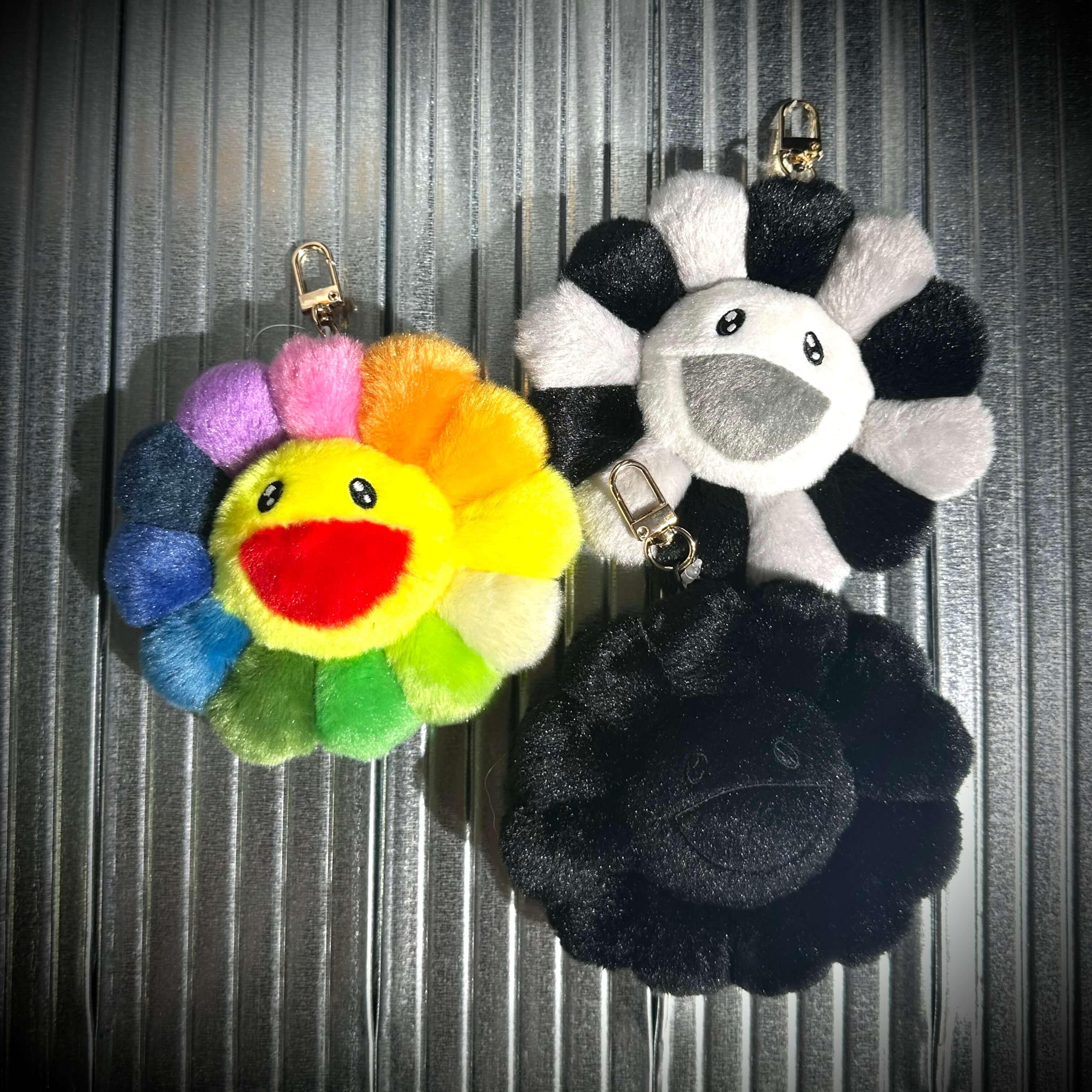 Takashi Murakami Mascot Plush Keychain featuring colorful flower designs in plush material.