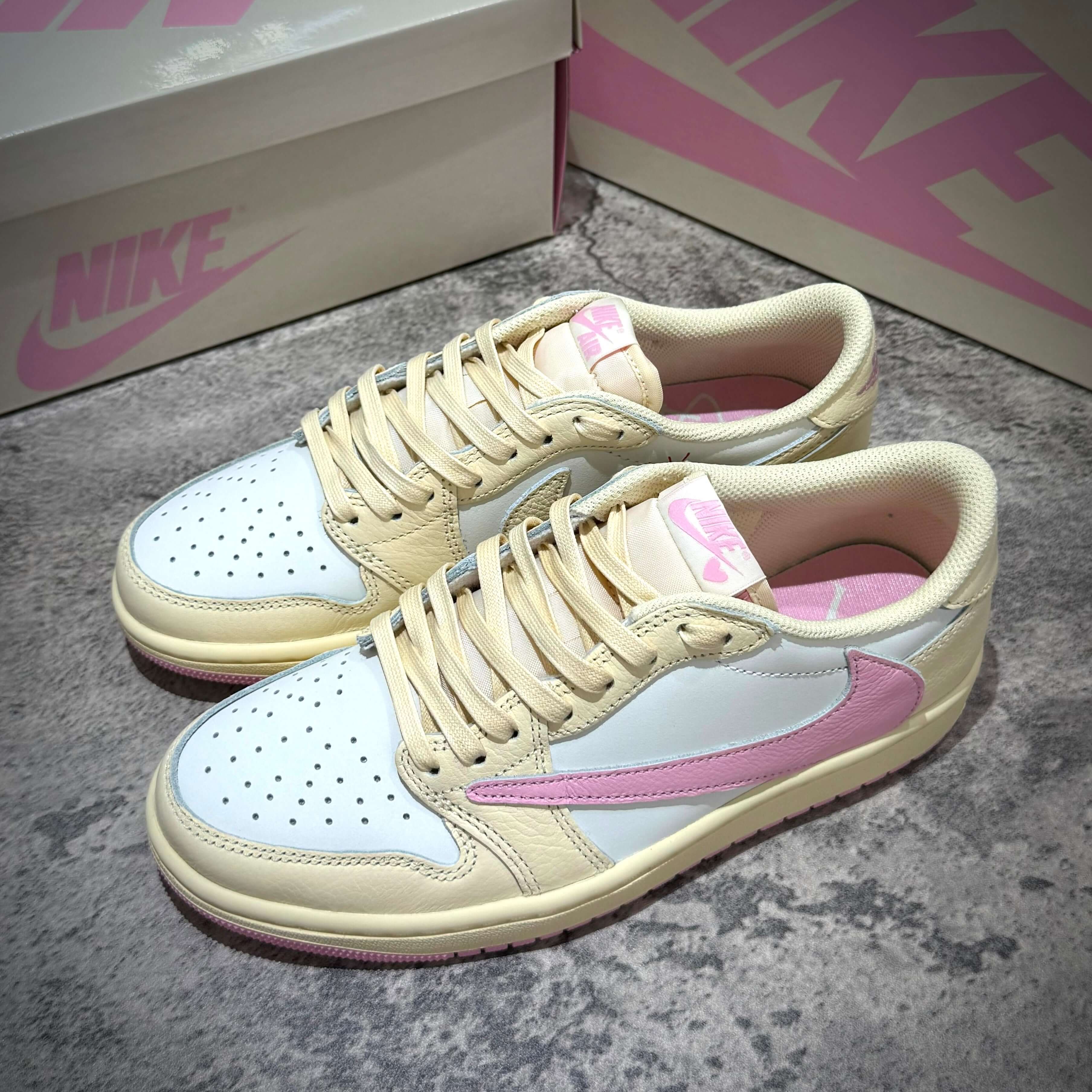 Image of Travis Scott × Nike Air Jordan 1 Retro Low SP - Shy Pink sneakers with cream and pink design, SKU: IQ7604-100.