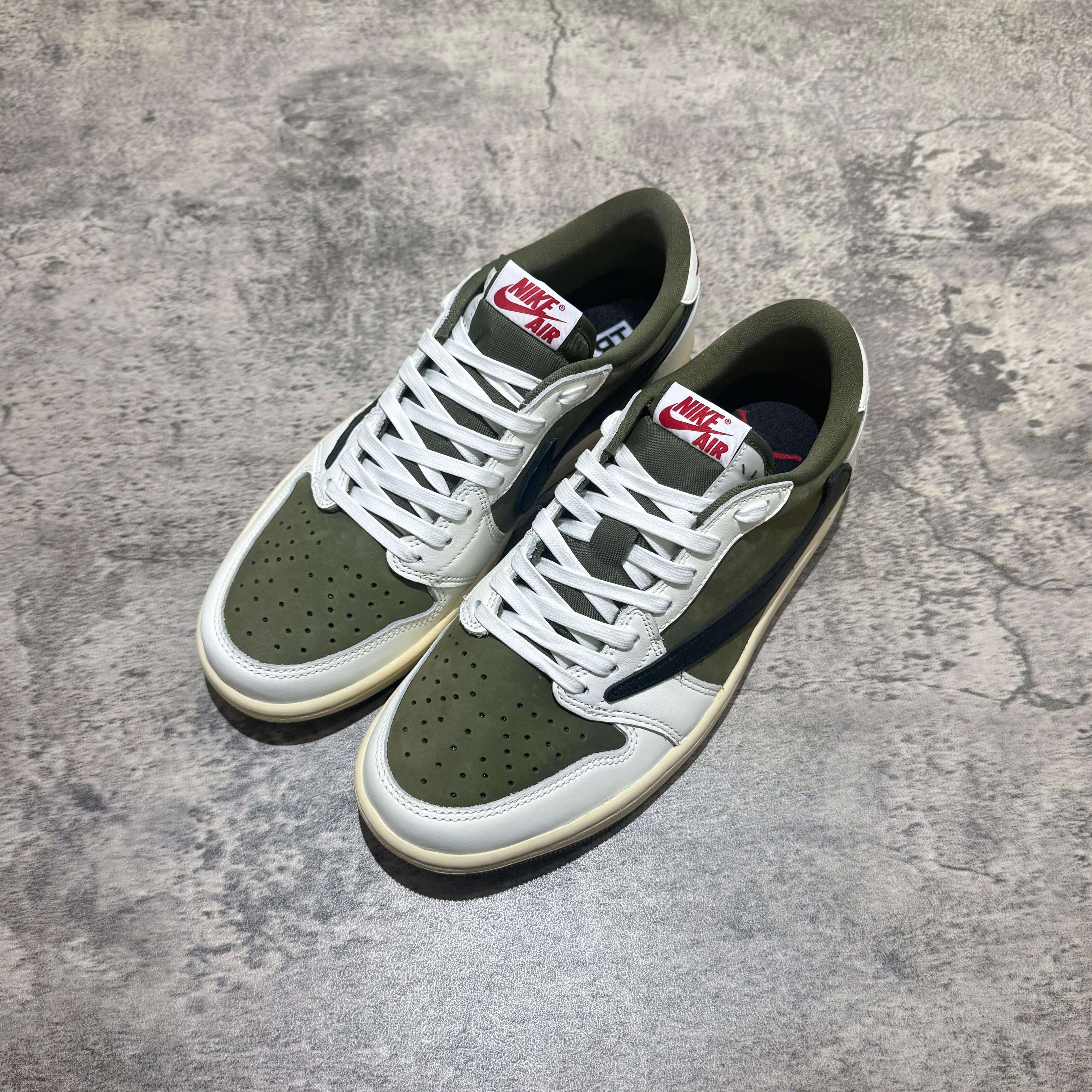 Travis Scott x Air Jordan 1 Low 8.0 Medium Olive sneaker top view with olive green and white colorway.