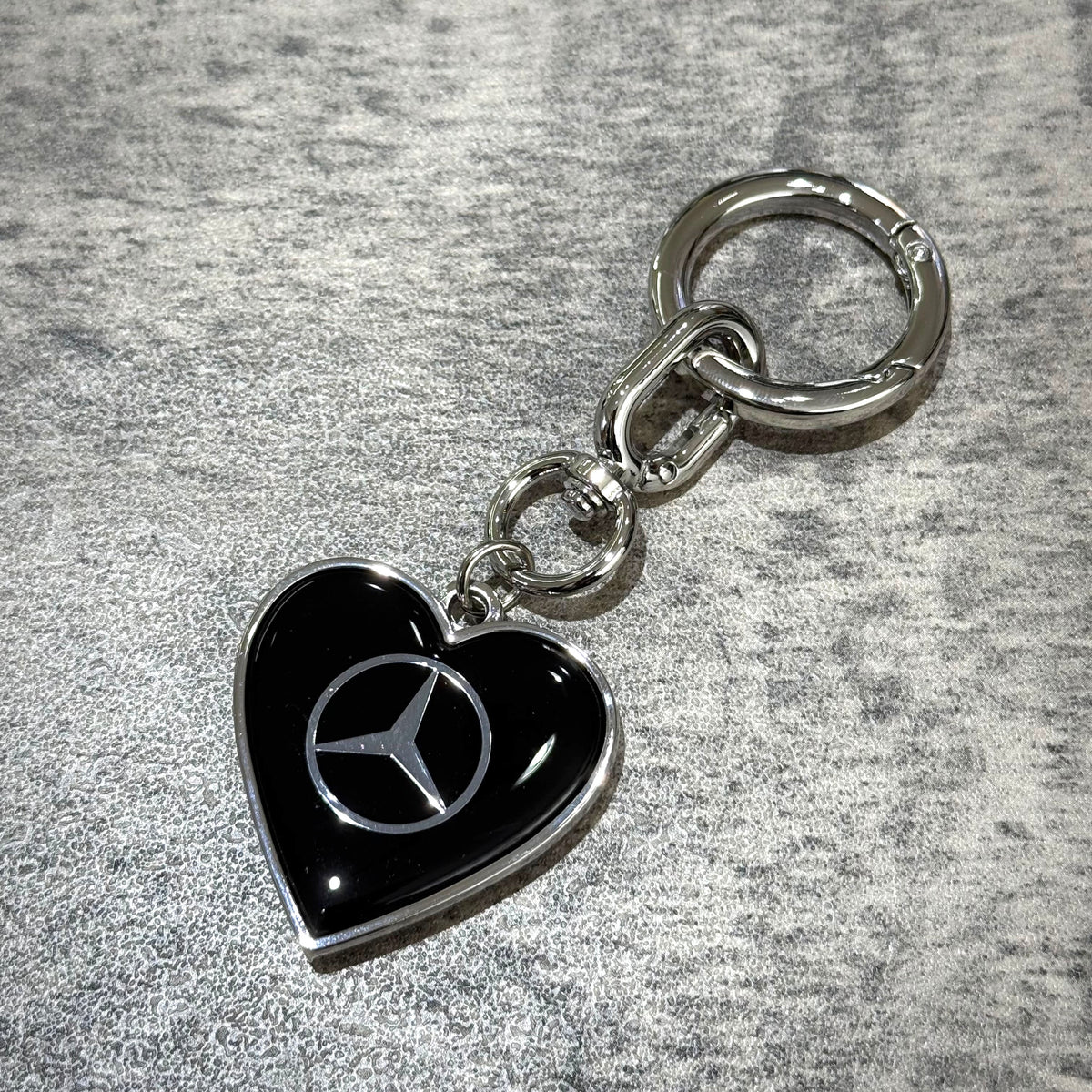 VERDY x Mercedes-Benz STUDIO TOKYO Keyring featuring a black heart charm with Mercedes-Benz logo.