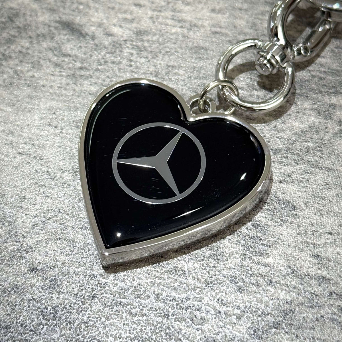 VERDY x Mercedes-Benz STUDIO TOKYO Keyring close-up featuring heart design and Mercedes-Benz logo.