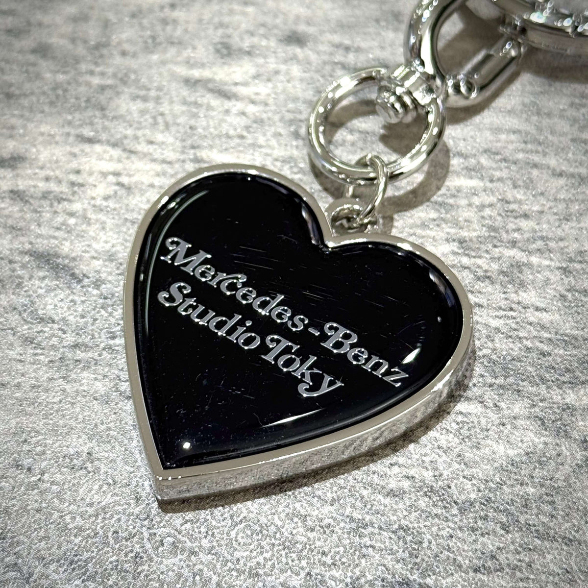 VERDY x Mercedes-Benz STUDIO TOKYO Keyring featuring a black heart design with engraved text