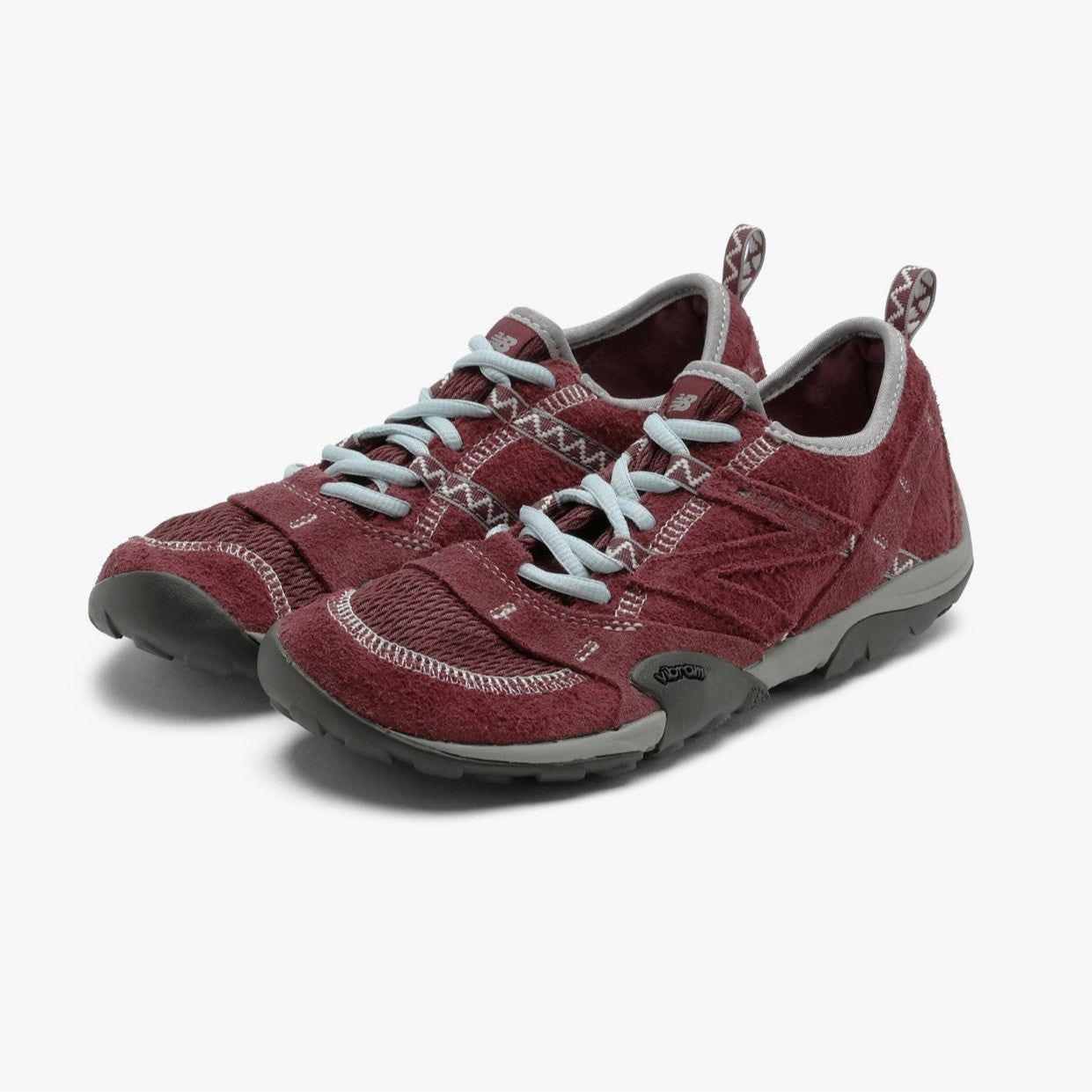 SUNLOVETOUR x New Blance MT1001ND shoes in burgundy with light blue laces and rugged soles.