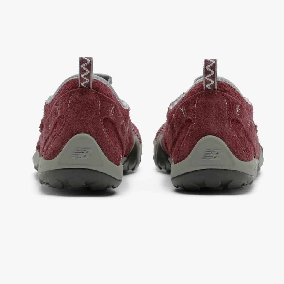 Back view of SUNLOVETOUR x New Blance MT1001ND shoes showcasing the innovative design and all-terrain capability.