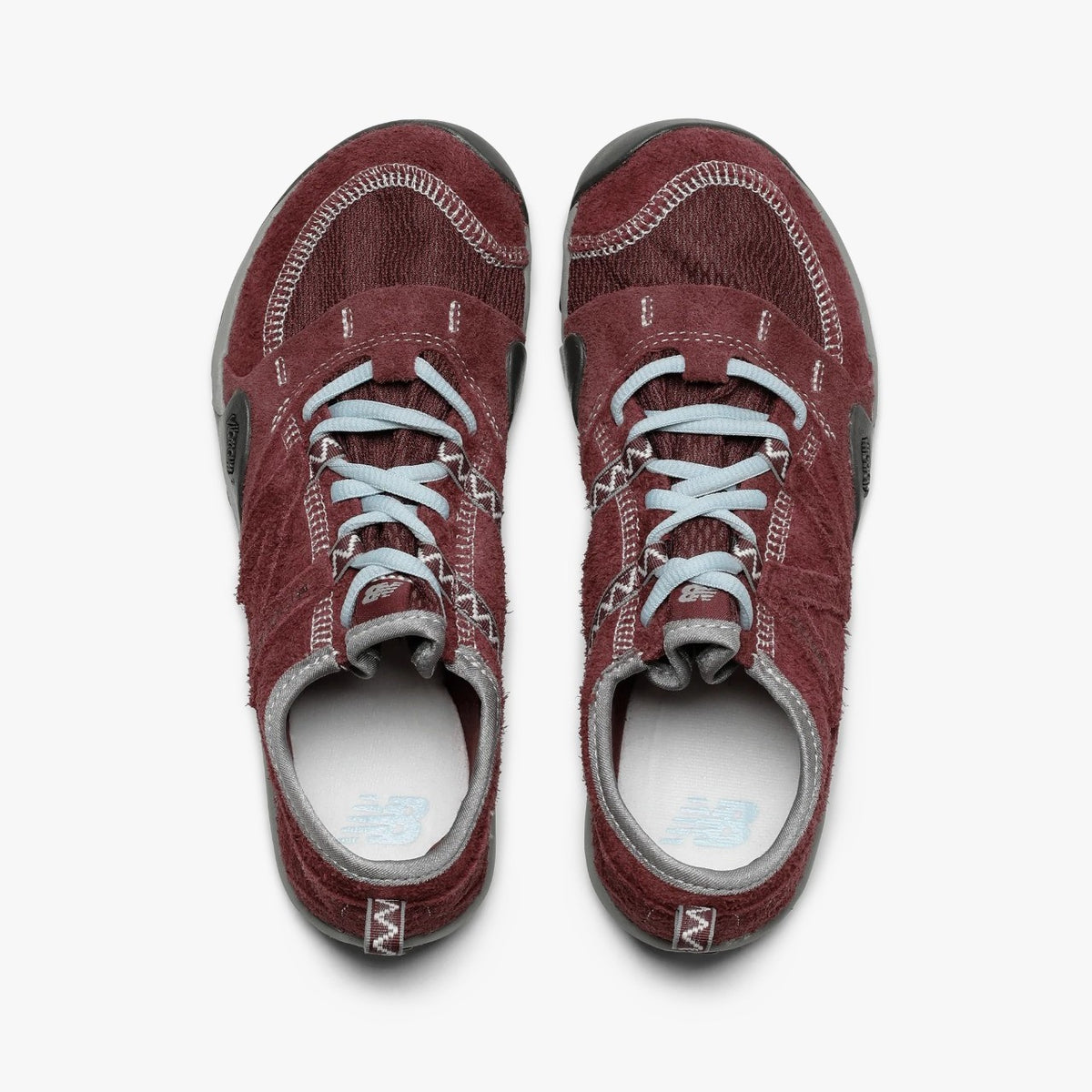 SUNLOVETOUR x New Blance MT1001ND sneakers in burgundy with light blue laces, top view.