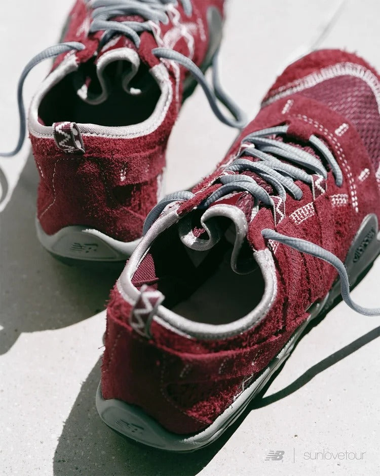 SUNLOVETOUR x New Blance MT1001ND maroon sneakers with gray laces and a textured finish seen from above.