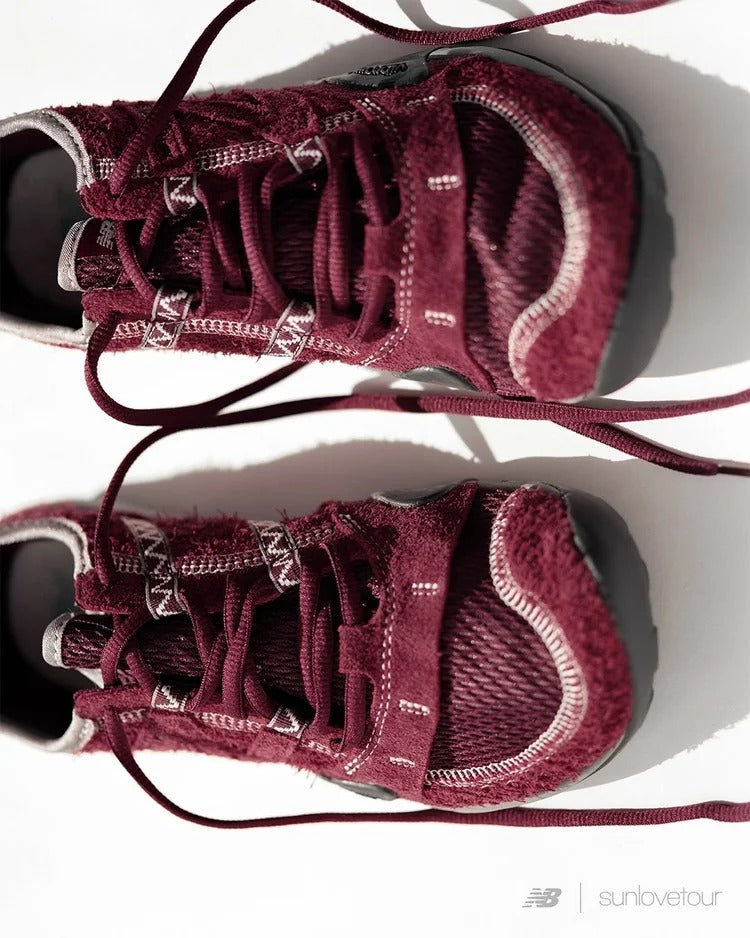 SUNLOVETOUR x New Blance MT1001ND burgundy sneakers displayed from above with detailed laces.