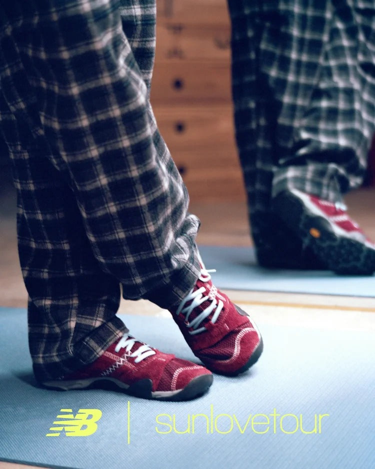SUNLOVETOUR x New Blance MT1001ND stylish footwear worn on a yoga mat, showcasing modern all-terrain design.